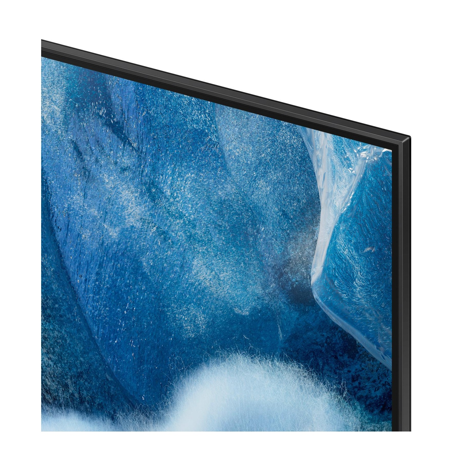 Primo piano di uno schermo TV con un'immagine blu astratta e un bordo nero.