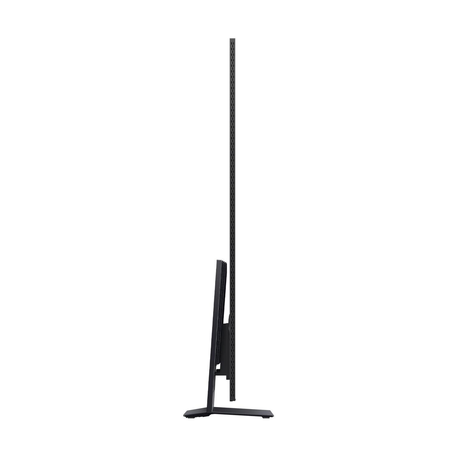 Una vista laterale di una TV sottile e nera su un supporto.