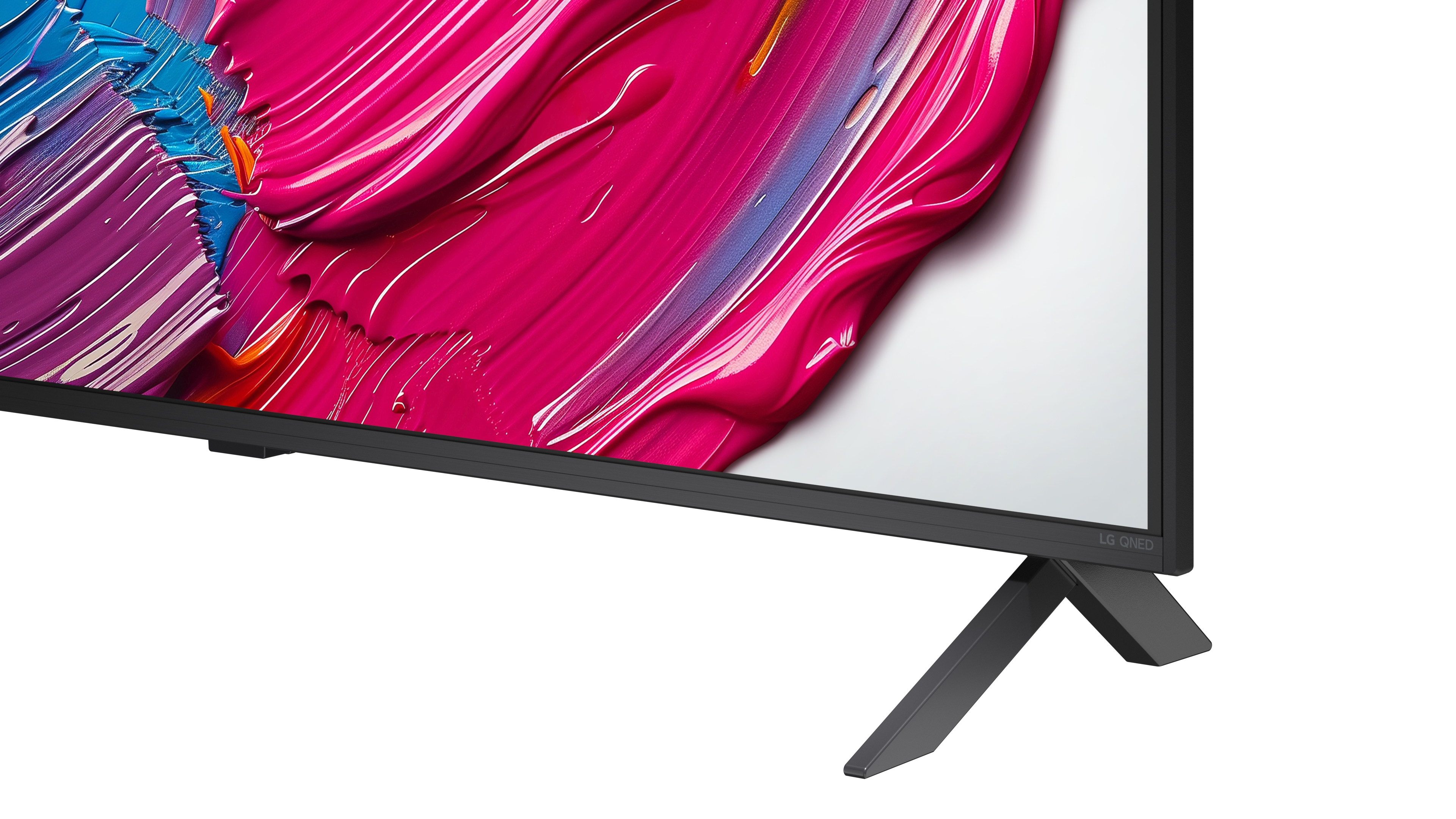 Nahaufnahme der TV-Beine und des unteren Randes. Der Bildschirm zeigt farbenfrohe abstrakte Kunst.