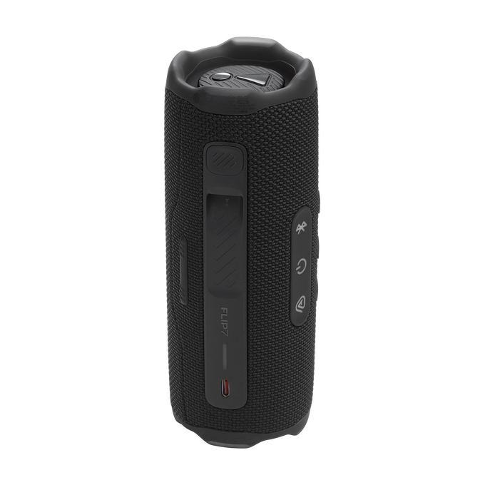 Altavoz portátil, cilíndrico y negro con botones. El altavoz está etiquetado como 'FLIP7'.