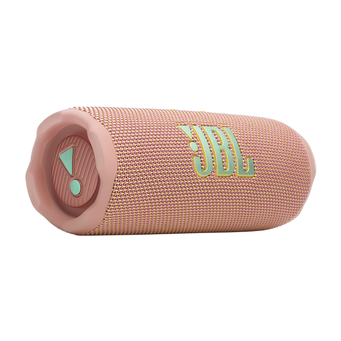 Un altavoz JBL rosa con detalles verdes se muestra en un primer plano. Tiene forma cilíndrica.