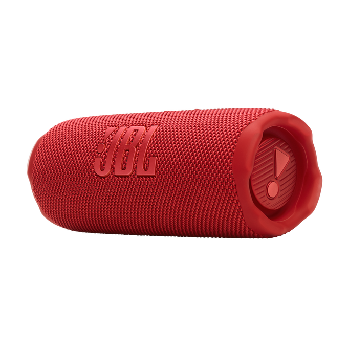 Altavoz JBL rojo. Forma cilíndrica. Textura de tela. Detalles negros en los extremos con botones.
