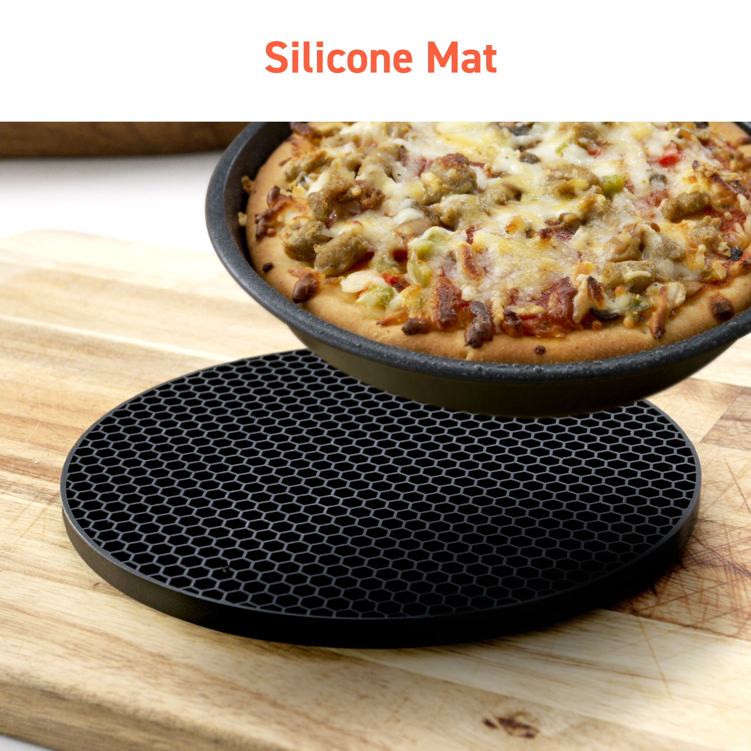 A black silicone mat with a pizza on top, placed on a wooden cutting board.