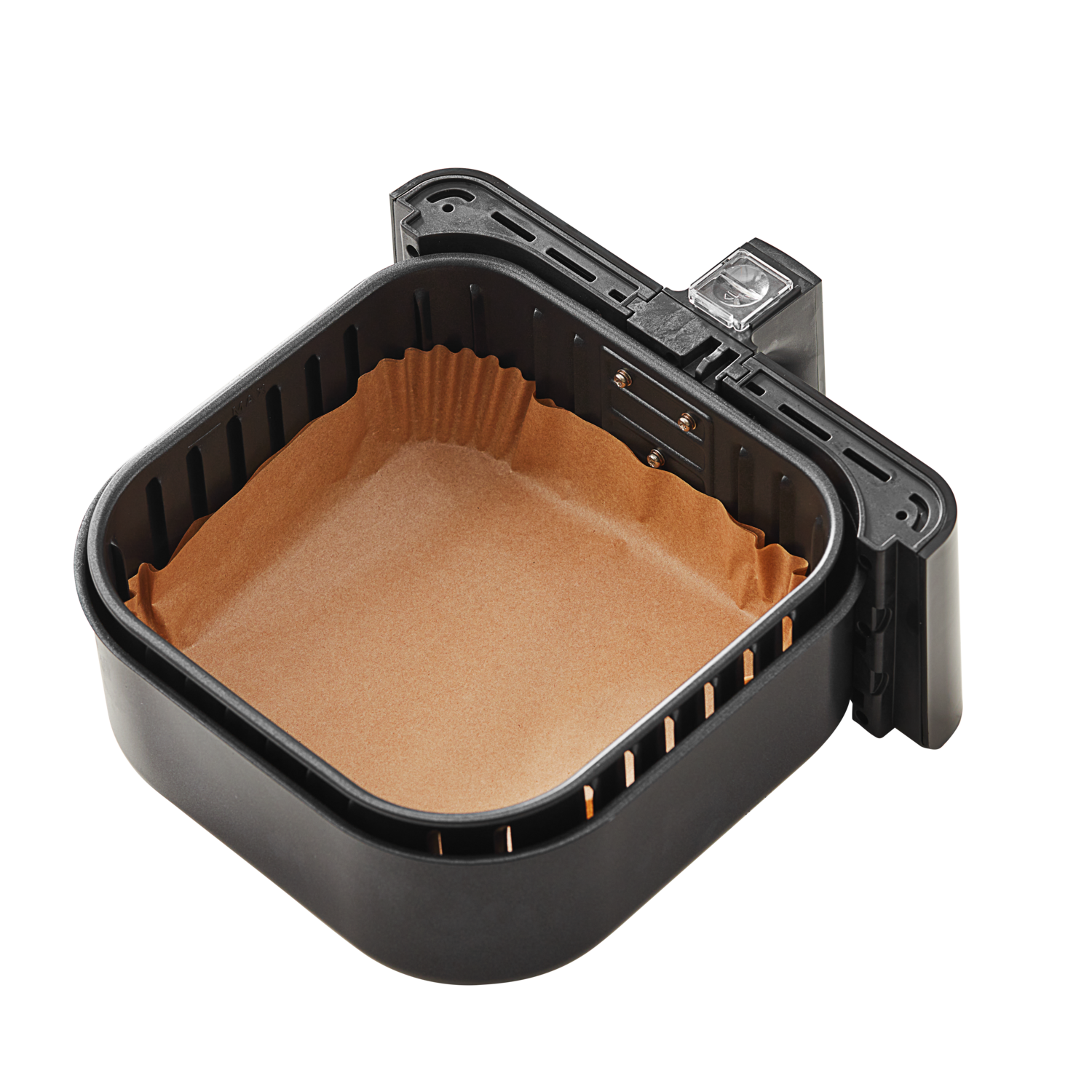 Air fryer basket with a paper liner, set against a black background.