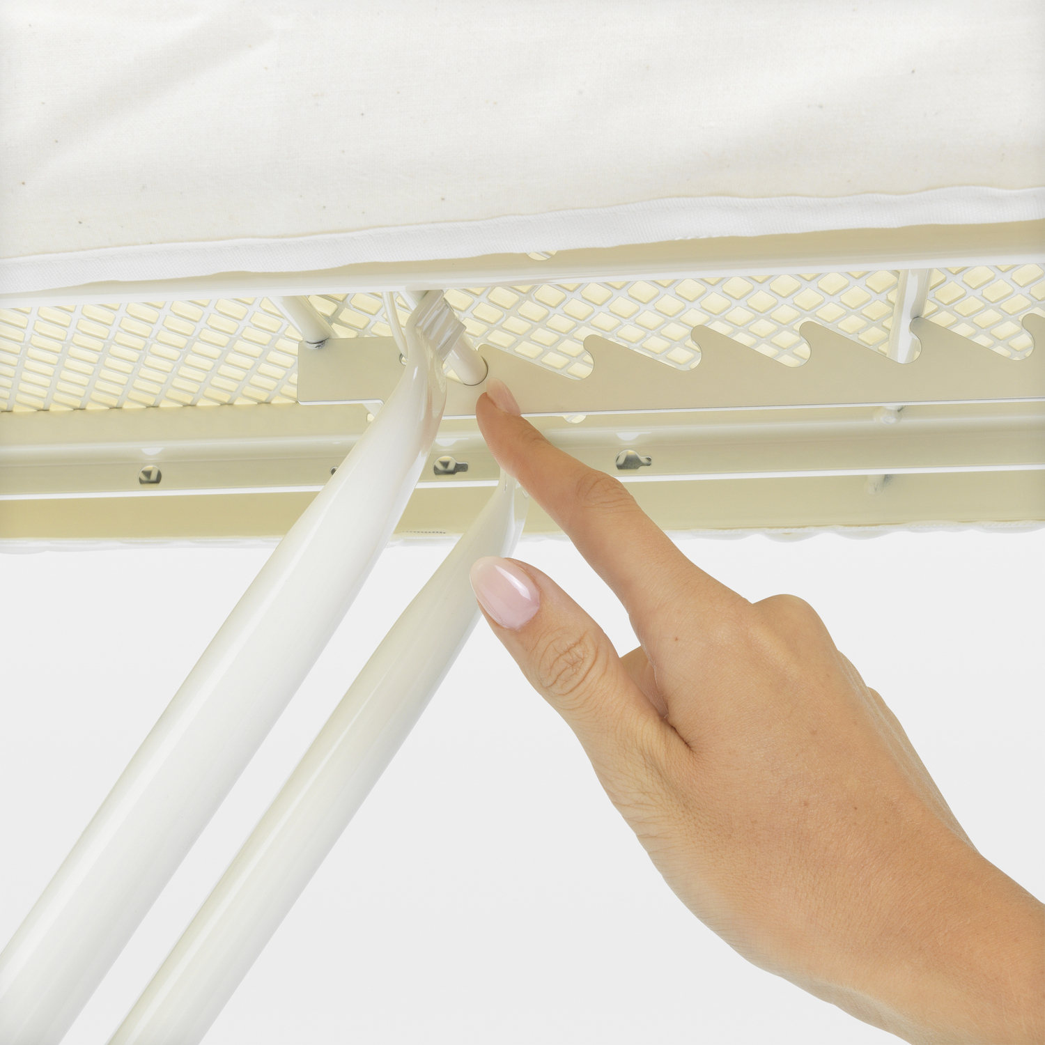 A hand pointing at the mechanism of an ironing board.