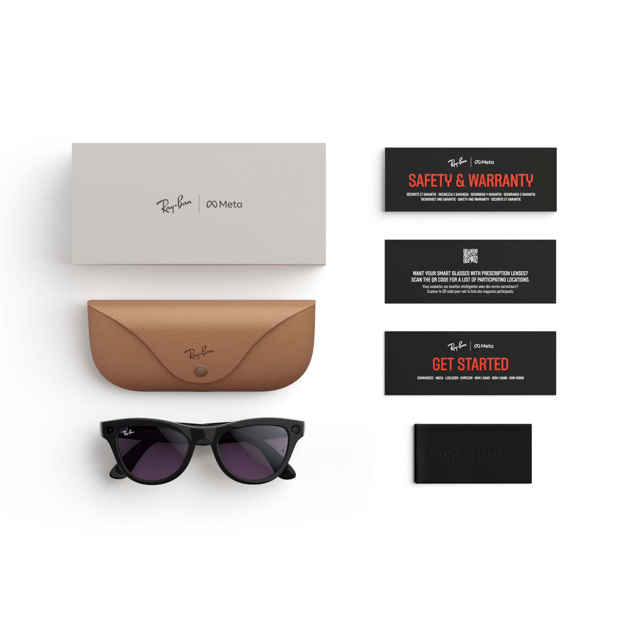Sonnenbrille, Etui, Schachtel und Karten auf weißer Oberfläche angeordnet.