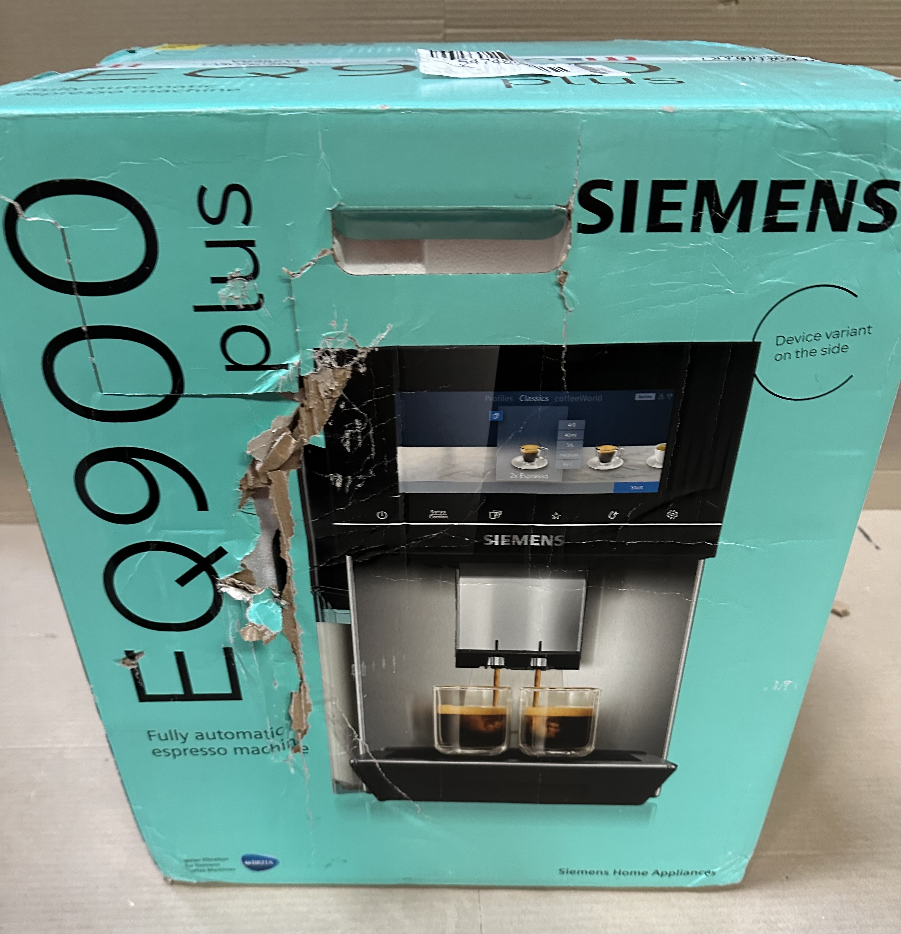 Uszkodzone, turkusowe pudełko ekspresu do kawy Siemens EQ900 plus.