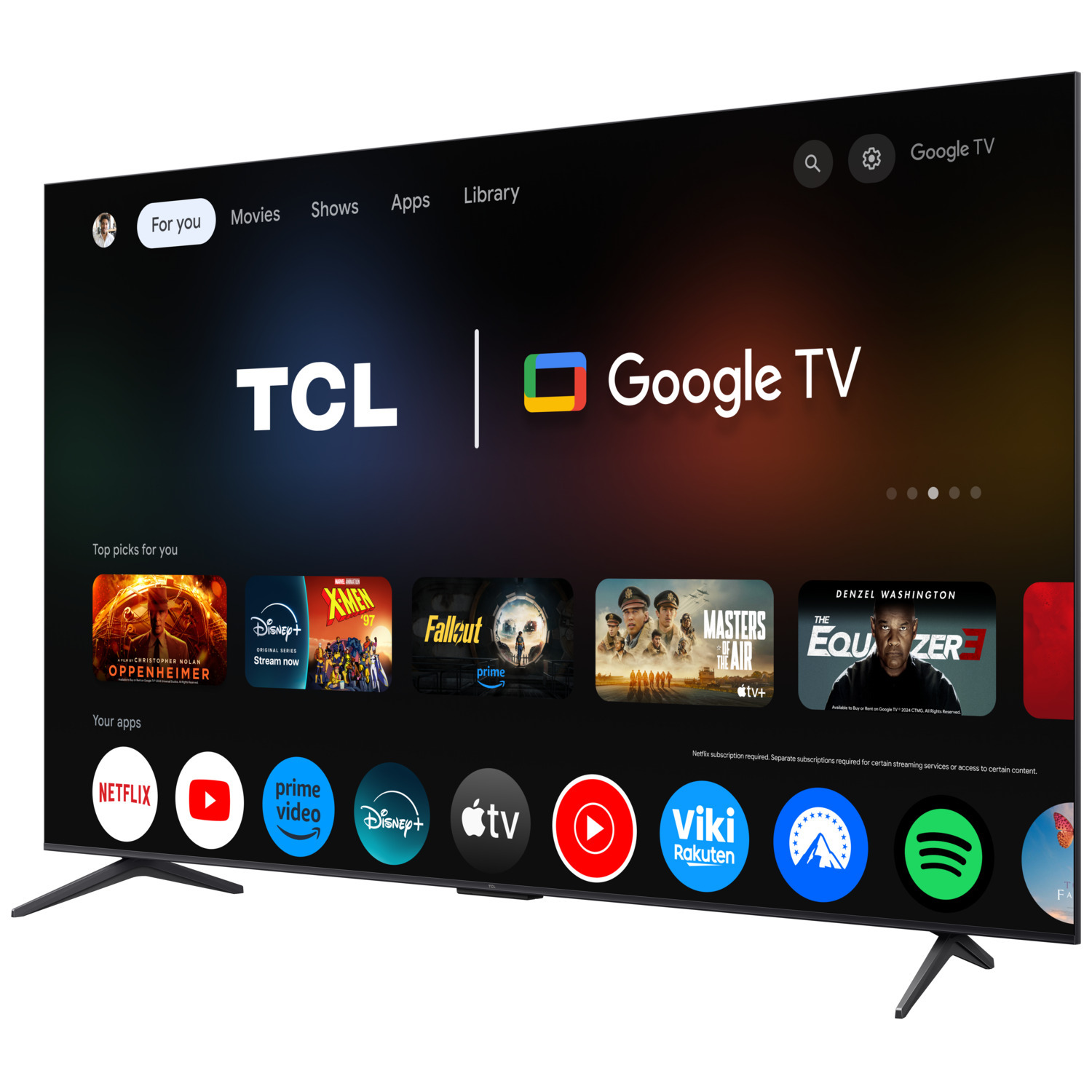 Un écran TCL Google TV affichant des applications. Une télécommande est à gauche. Une télévision avec des pieds noirs.