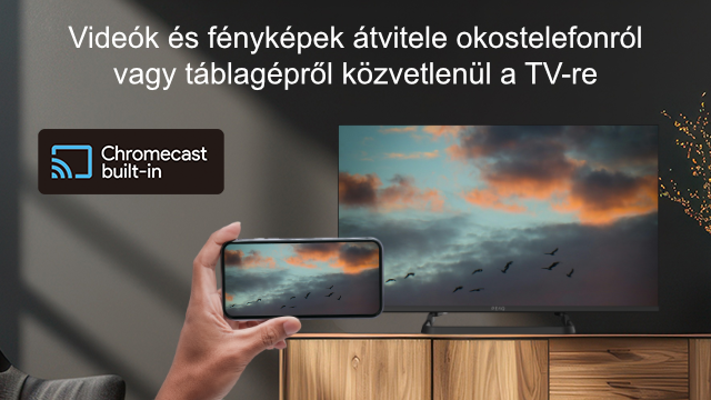 Telefon, amely naplementés jelenetet jelenít meg a TV-n.
