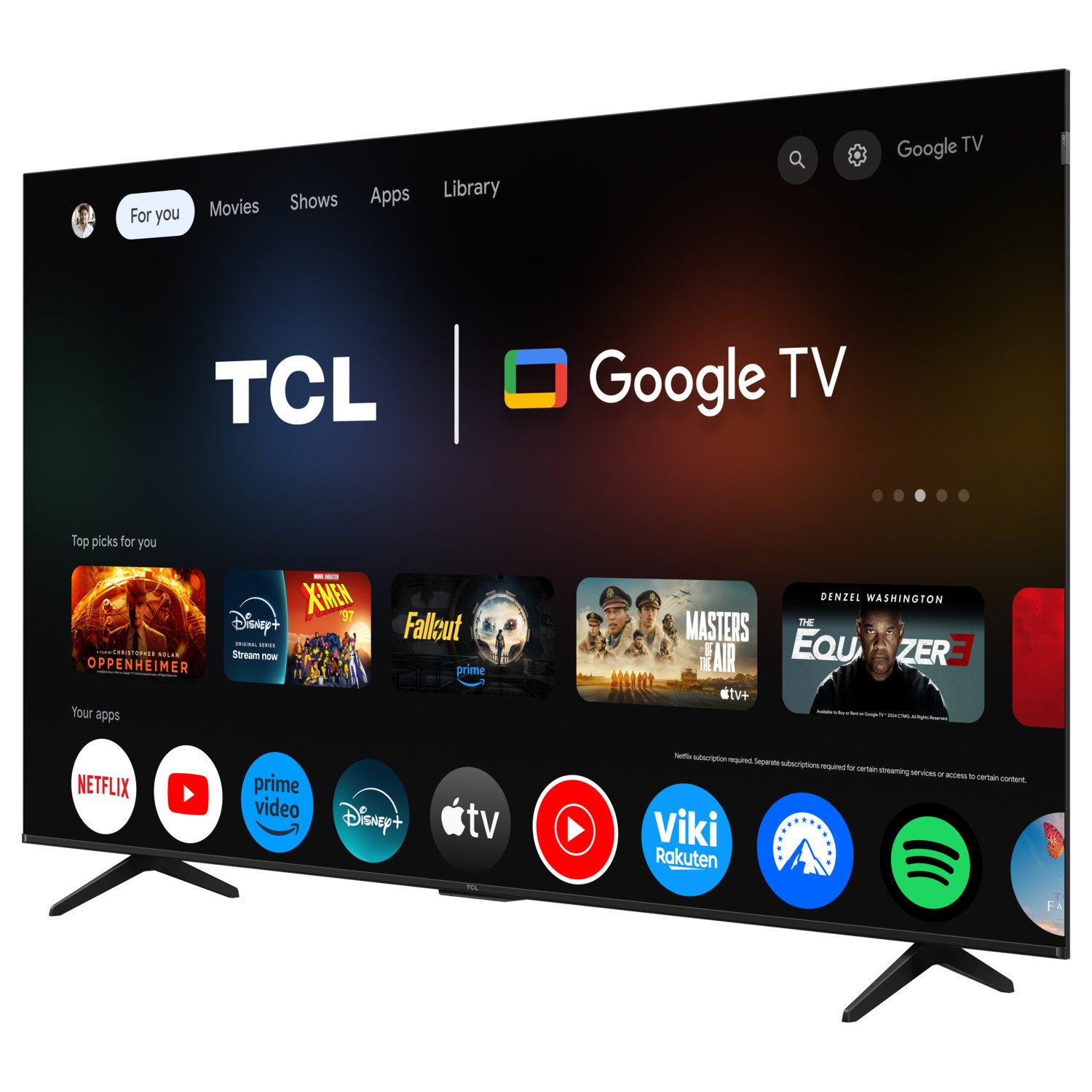 A Google TV screen with a TCL logo, offering movie and app options on a stand.