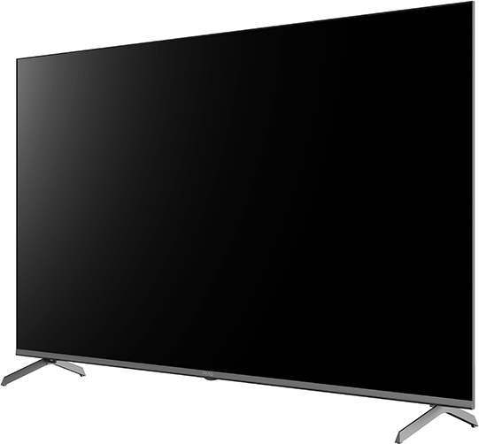 Egy nagy fekete TV ezüst lábakkal, oldalról megdöntve. A képernyő ki van kapcsolva.