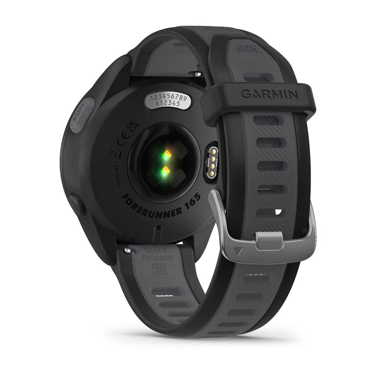 Reloj Garmin negro con correa gris, parte inferior hacia arriba, mostrando sensores y número de serie.