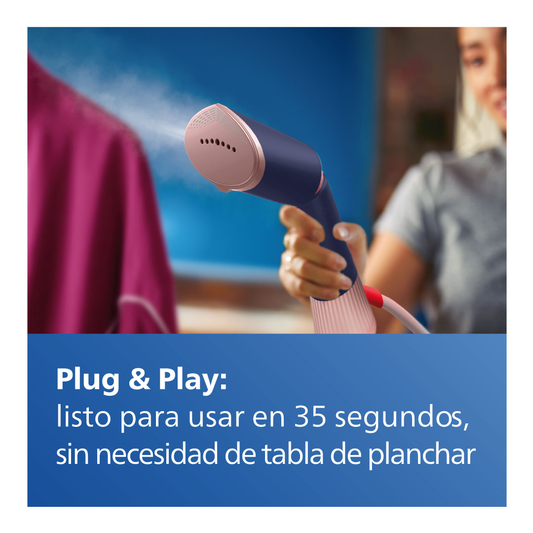 Vaporizador de ropa portátil vaporizando una prenda, texto en español.