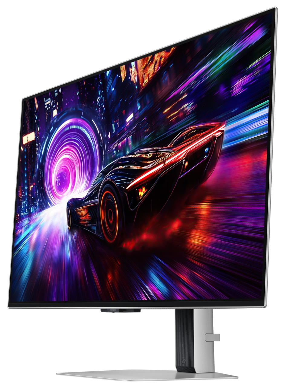 Zakrzywiony monitor wyświetlający samochód pędzący przez miasto oświetlone neonami.