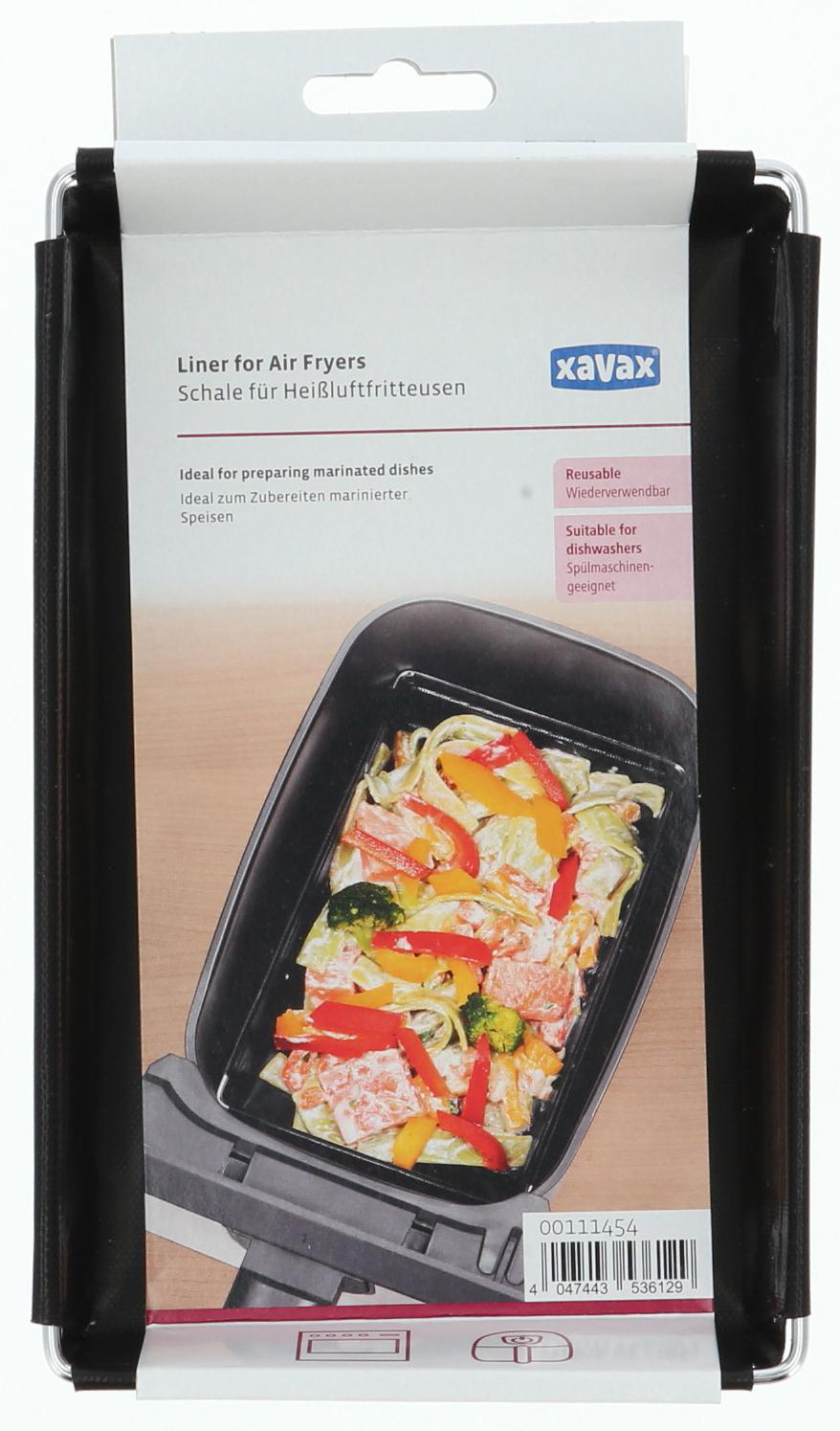 Eine Verpackung für Heißluftfritteusen-Einsätze, mit Essen in der Heißluftfritteuse.