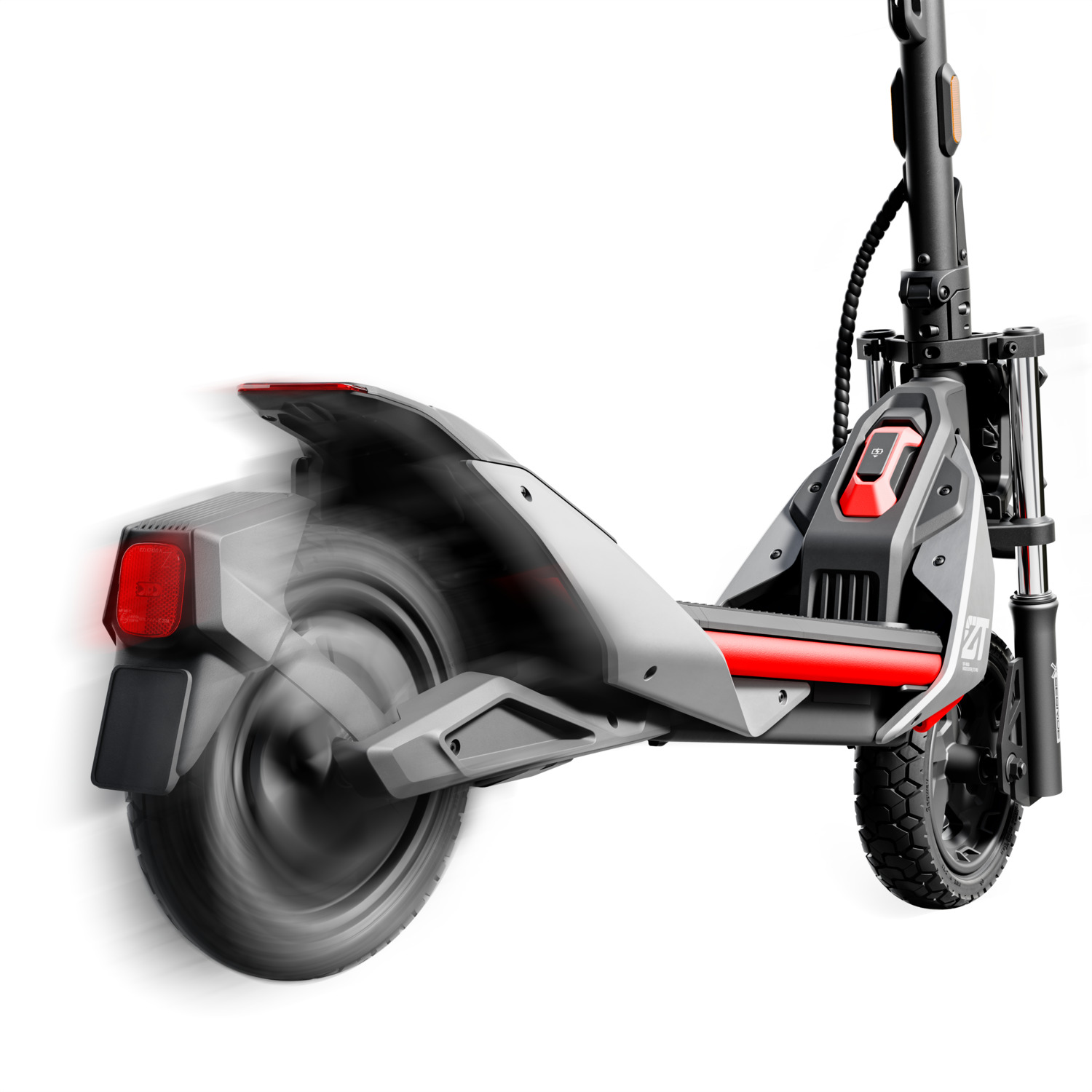 Une trottinette électrique en mouvement, montrant la roue arrière en rotation et le feu arrière rouge allumé.