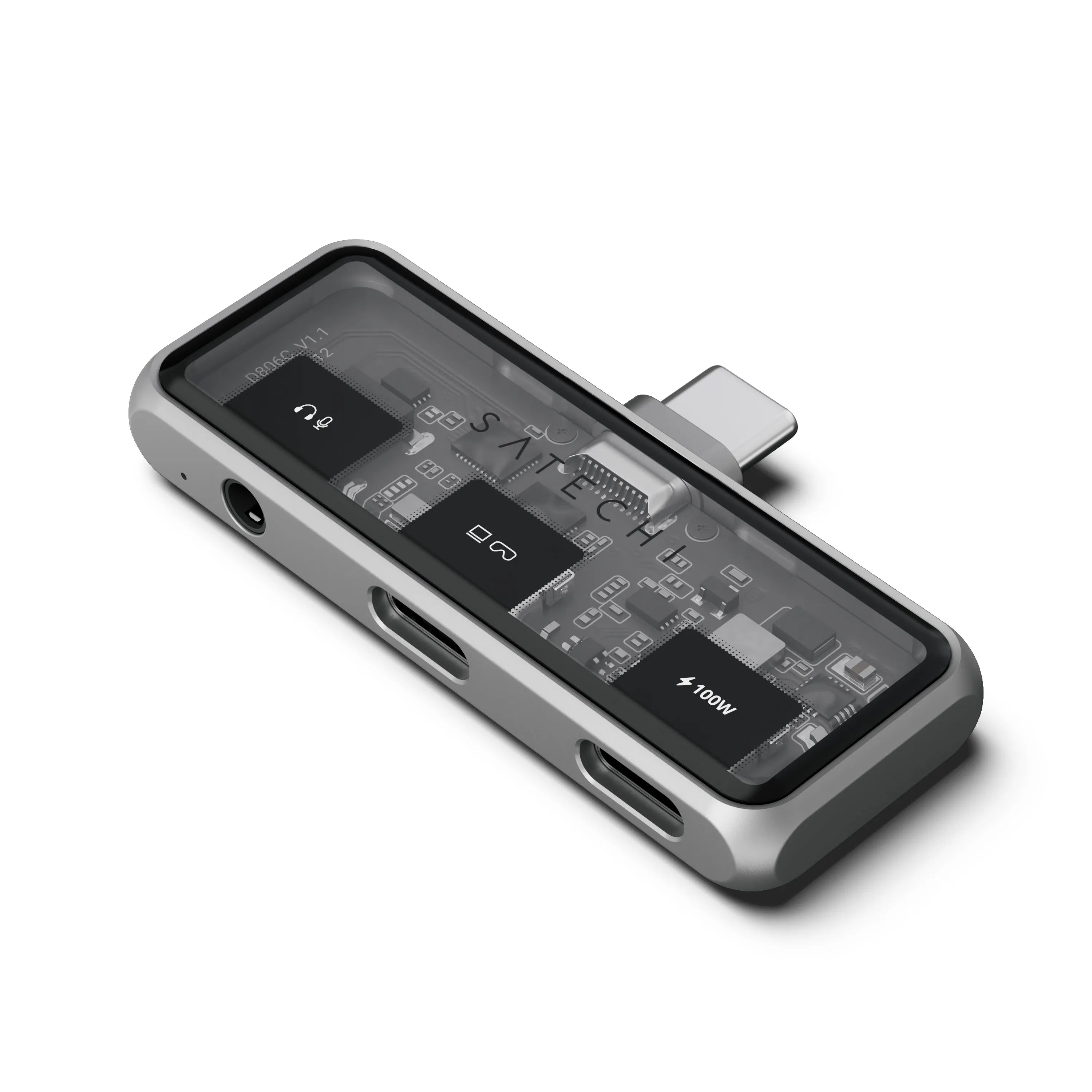 Ein silbernes und transparentes elektronisches Gerät mit Anschlüssen und sichtbarer Platine.