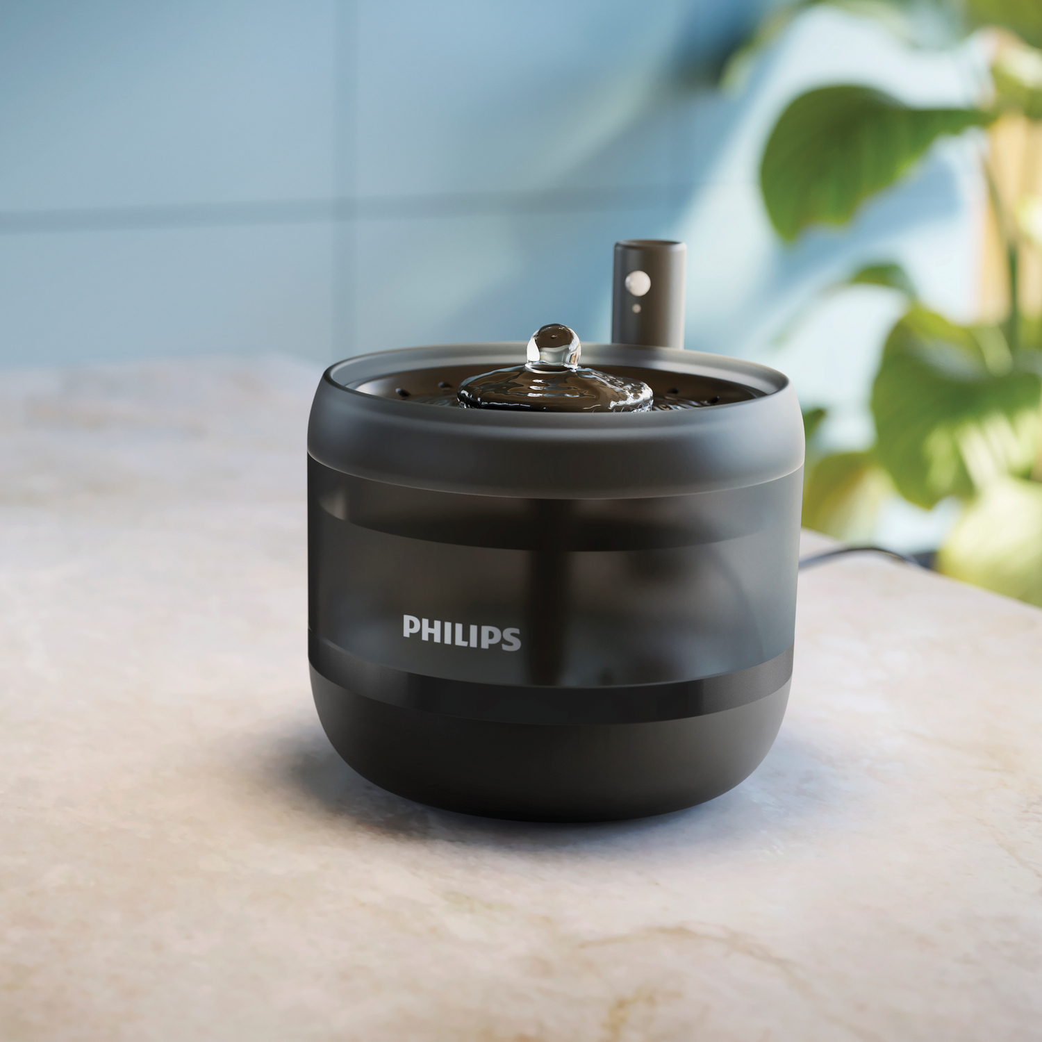 Una fuente de agua para mascotas Philips negra con una gota de agua y una planta en el fondo.