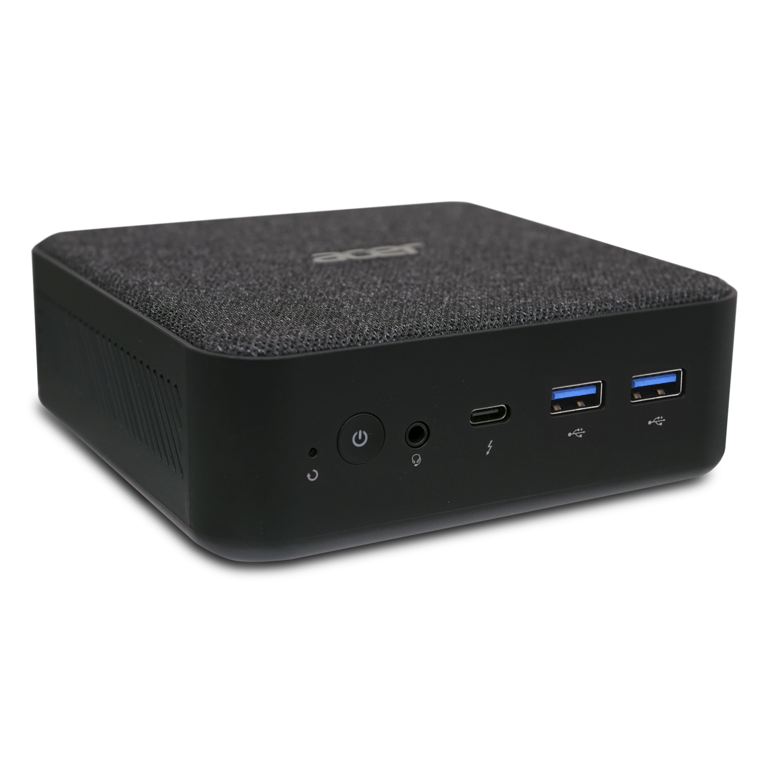 A black mini PC, with a fabric top, and ventilation grilles on the side.