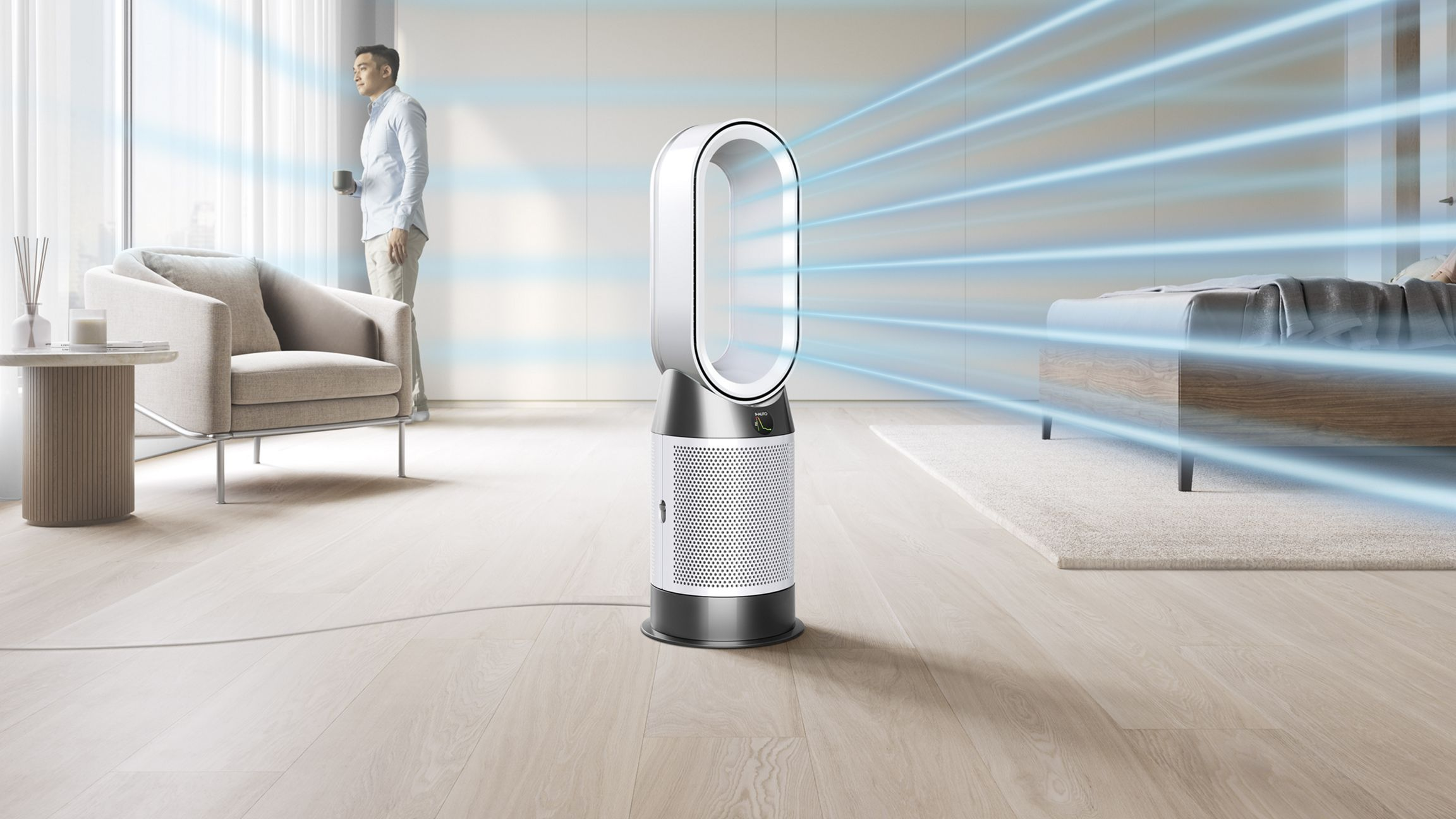 Purificateur d'air Dyson avec flux d'air bleu dans une pièce lumineuse.