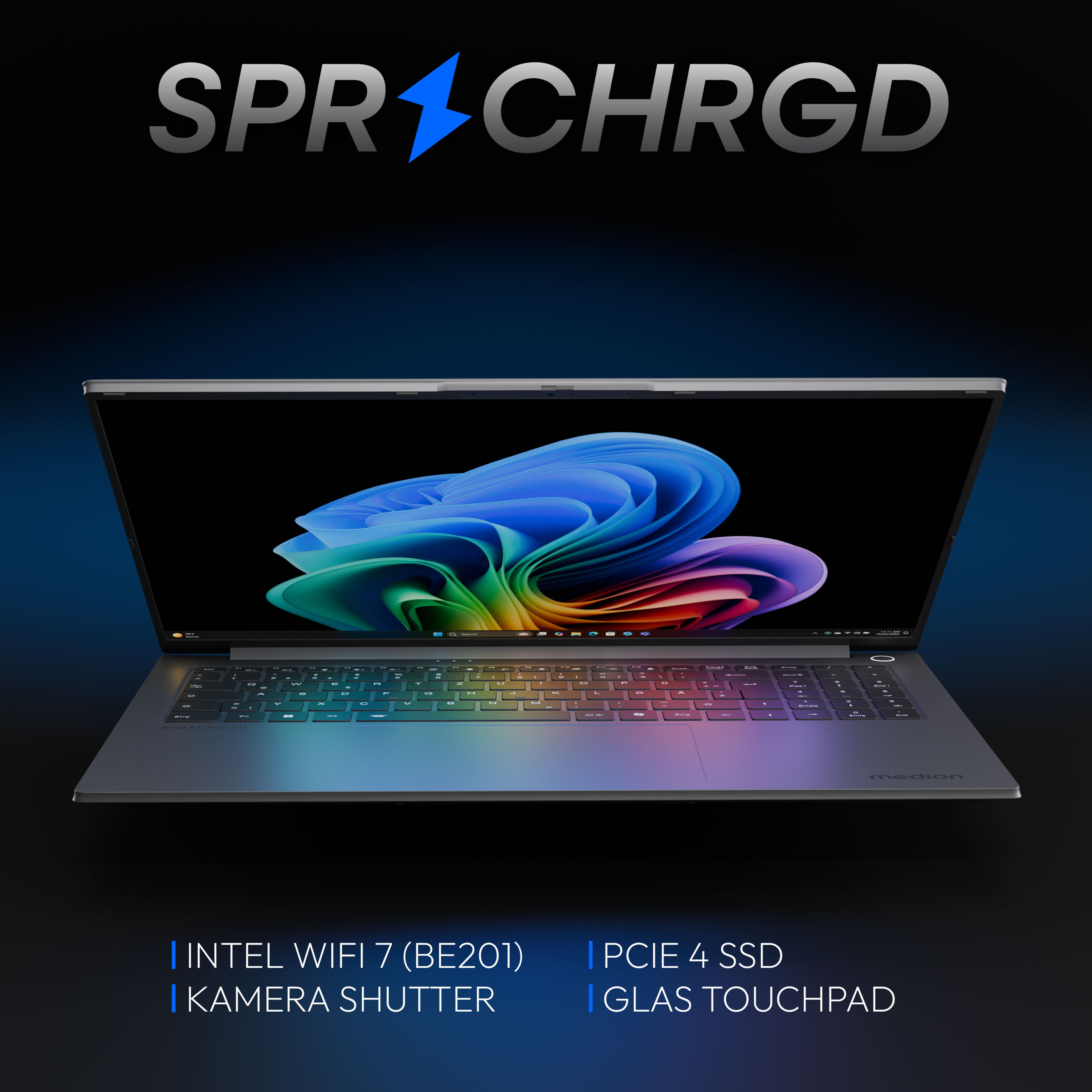 Laptop, bunte Tastatur, offen. Text oben, blau/schwarz.