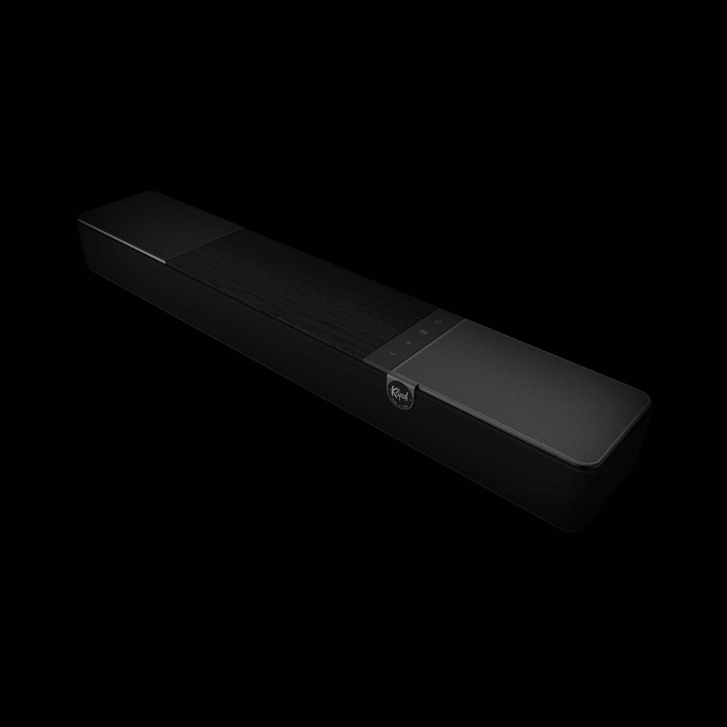 Zwarte soundbar. De bovenkant heeft een houtnerfpatroon. Klipsch logo is zichtbaar.