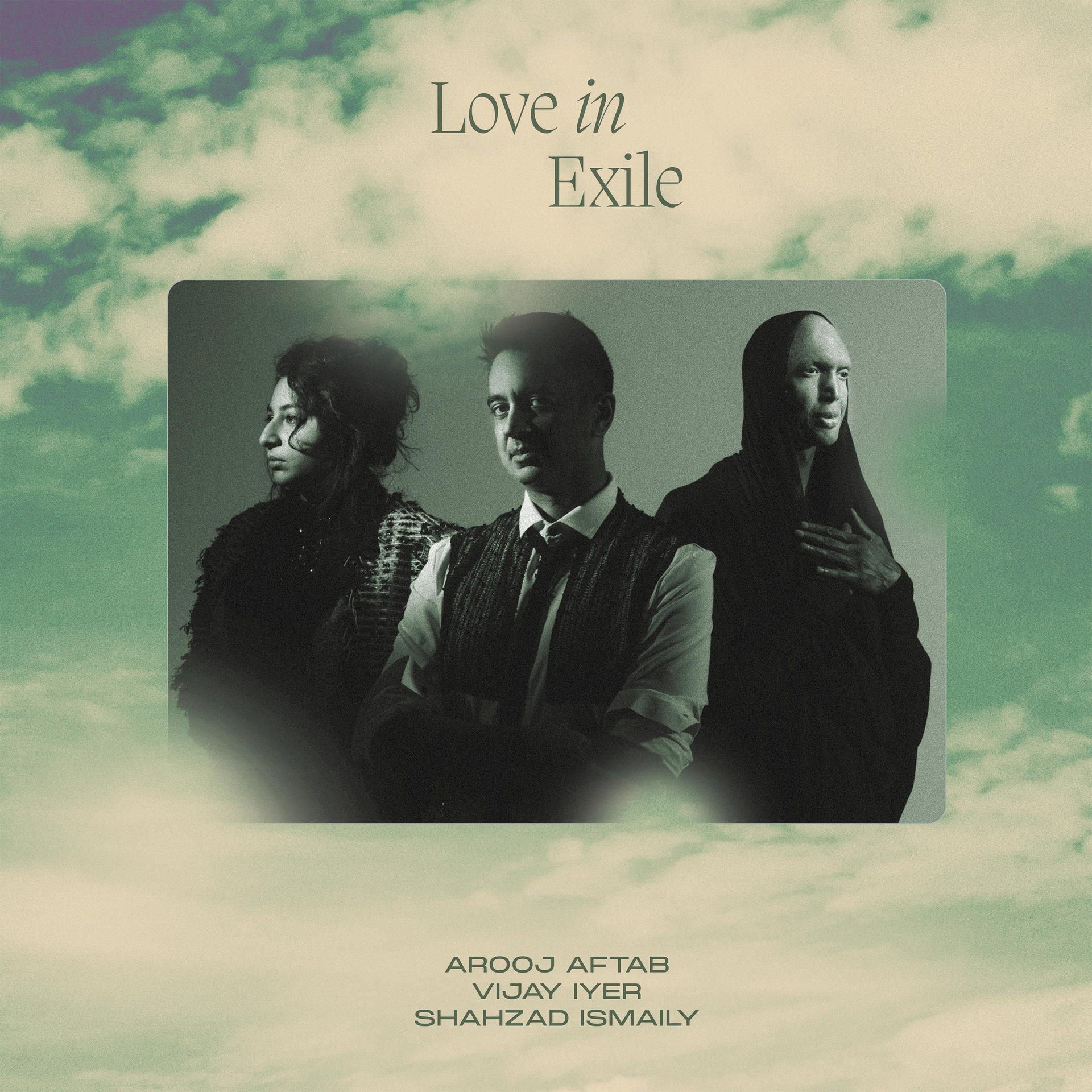Album borító három emberrel, a 'Love in Exile' szöveggel zöld, felhős háttéren.