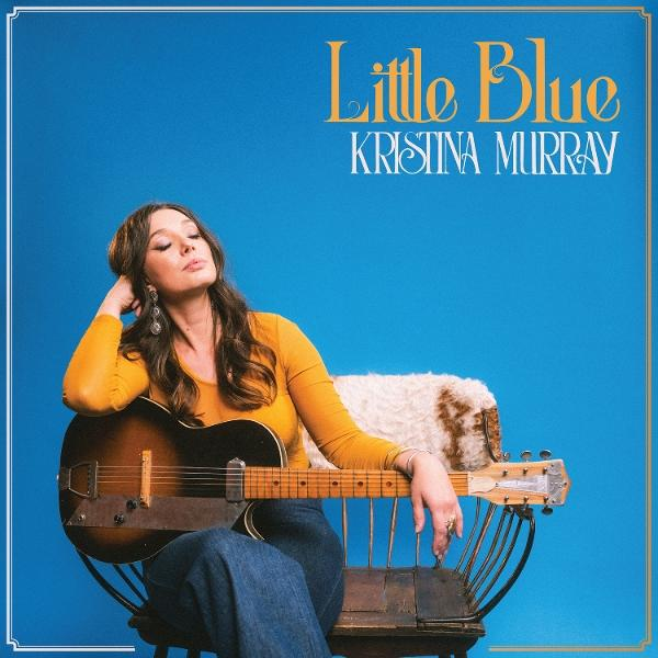 Eine Frau sitzt mit Gitarre vor blauem Hintergrund. Albumtitel ist Little Blue.