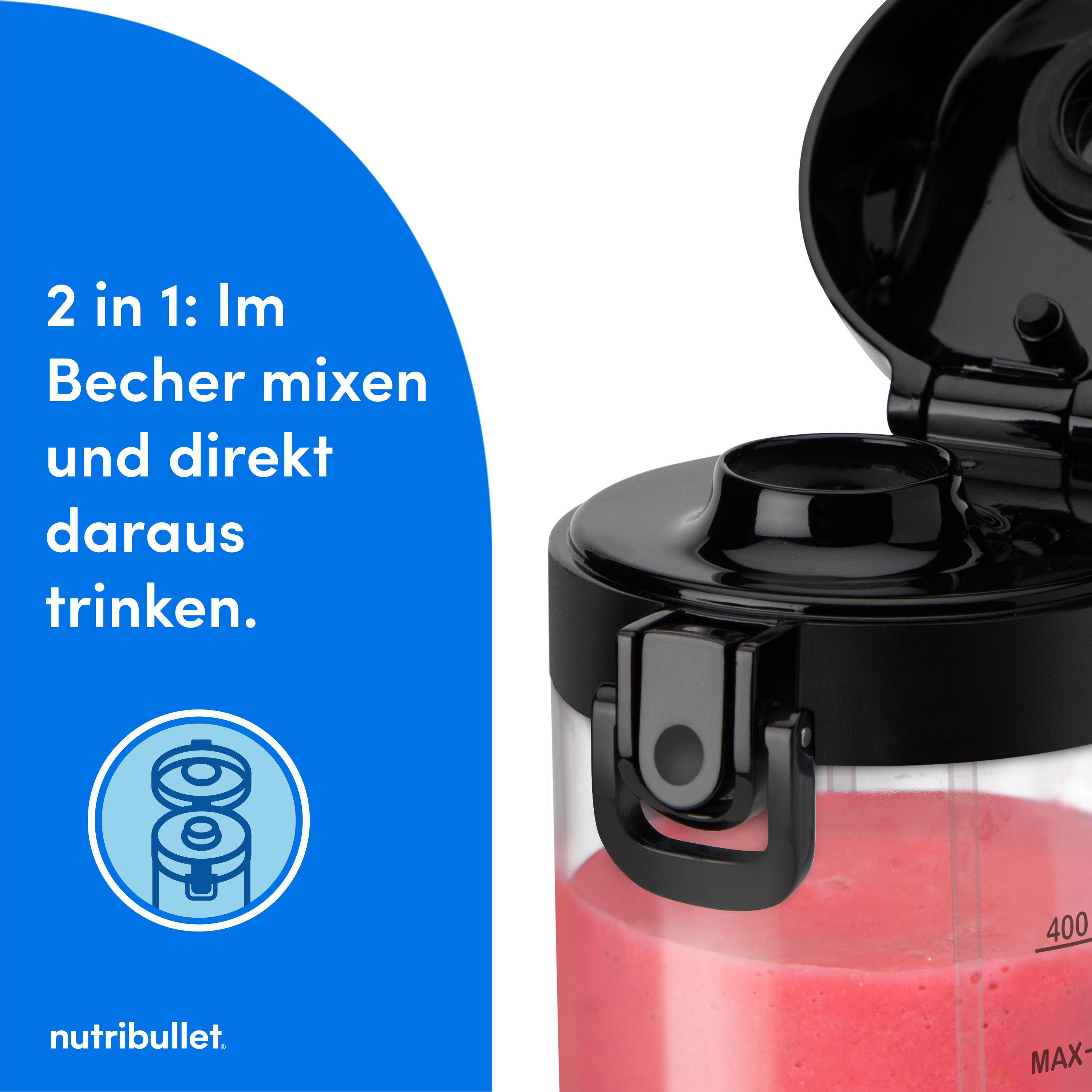 Mixer mit roter Flüssigkeit, schwarzem Deckel und Text. Rosa Hintergrund, Nahaufnahme.