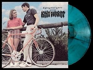Albumcover mit Paar am Fahrrad und türkisfarbener Vinylplatte. Das Album ist 'King Parrot'.