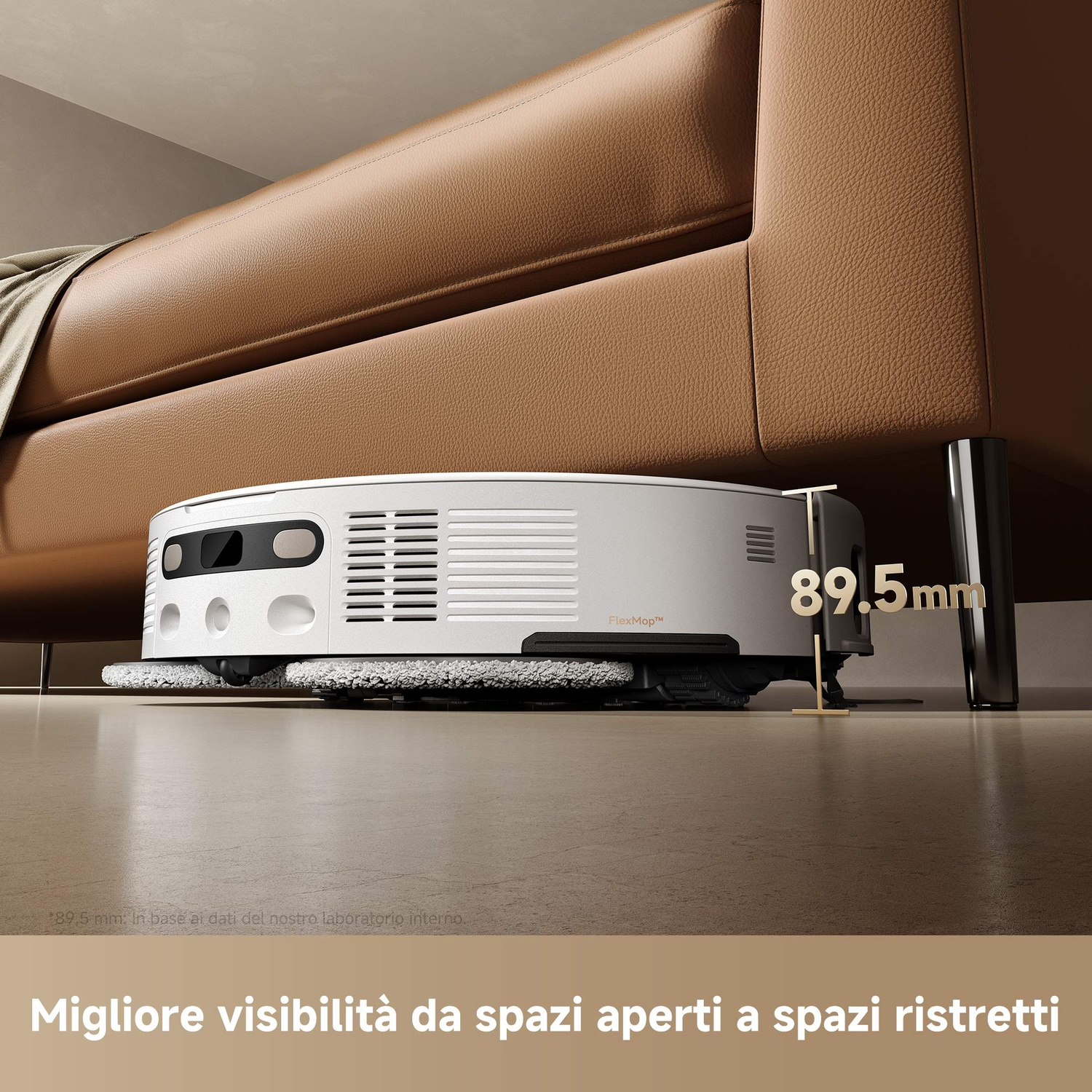 Robot aspirapolvere sotto un divano marrone, con testo.