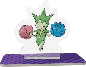 Pokemon-Figur mit grünem Körper, rosa und blauen Blumen, auf lila Basis.