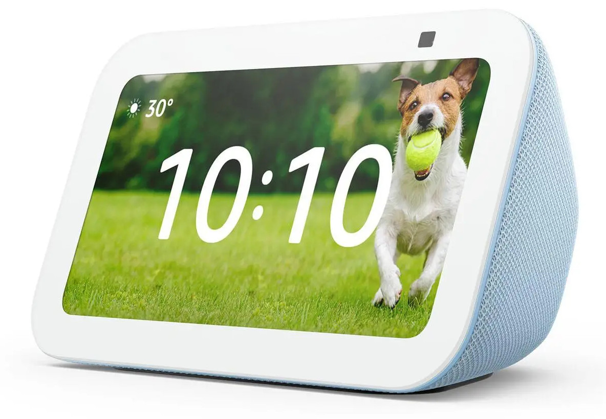 Biały inteligentny wyświetlacz z godziną 10:10 i psem z piłką tenisową na ekranie.
