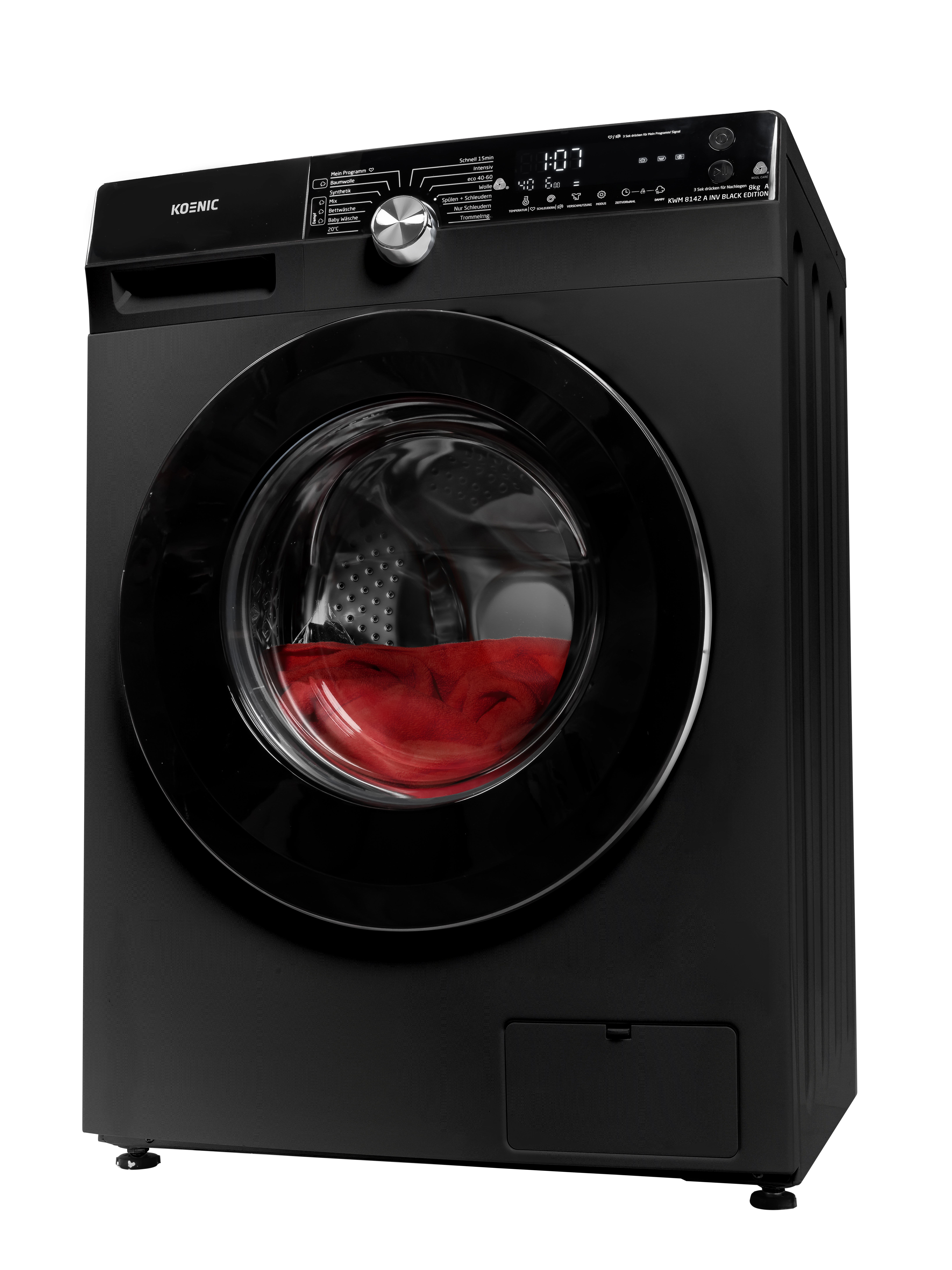 Eine schwarze Koenic Waschmaschine, durch die Glastür ist ein rotes Objekt sichtbar.