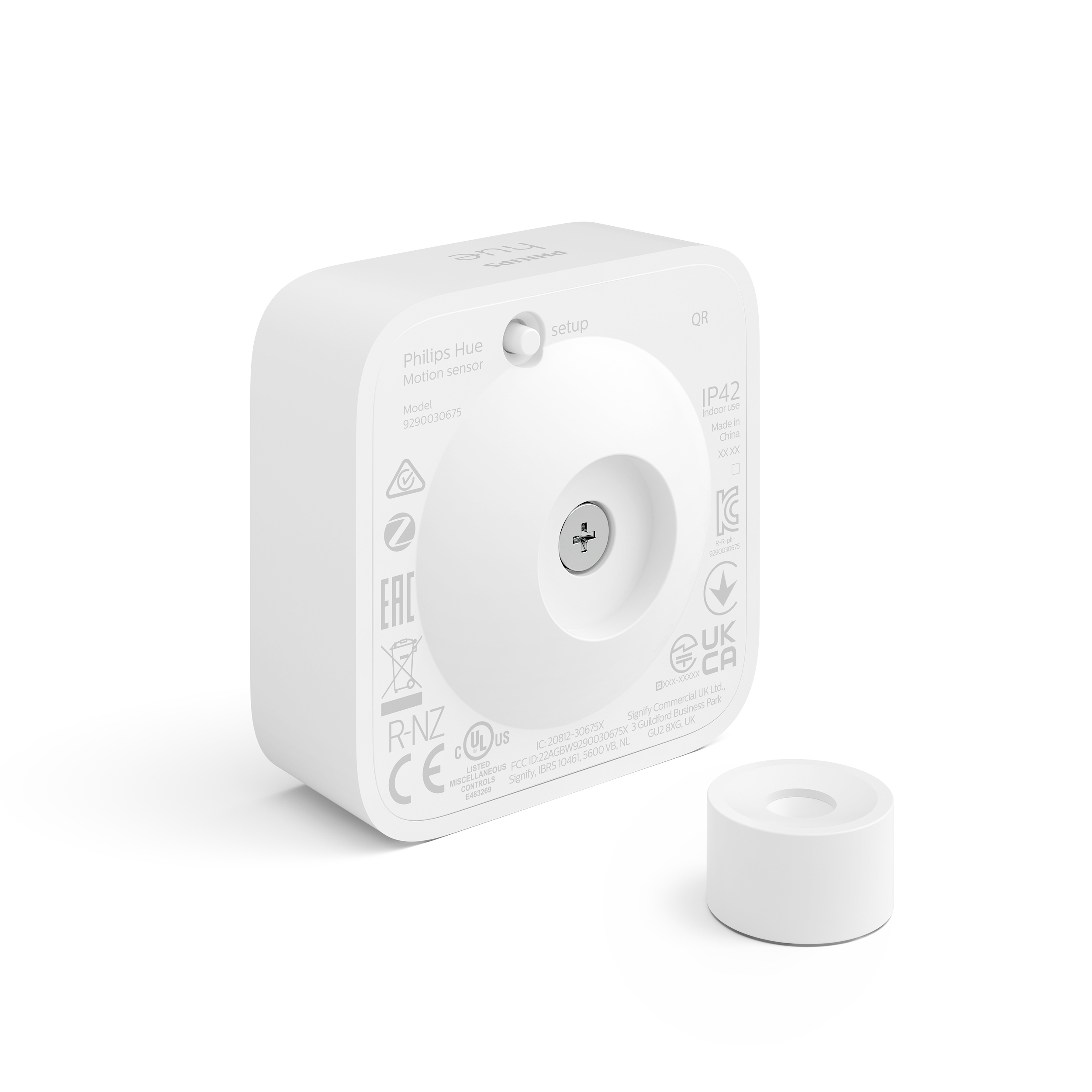 Weißer Philips Hue Bewegungssensor mit weißer Montagebasis.