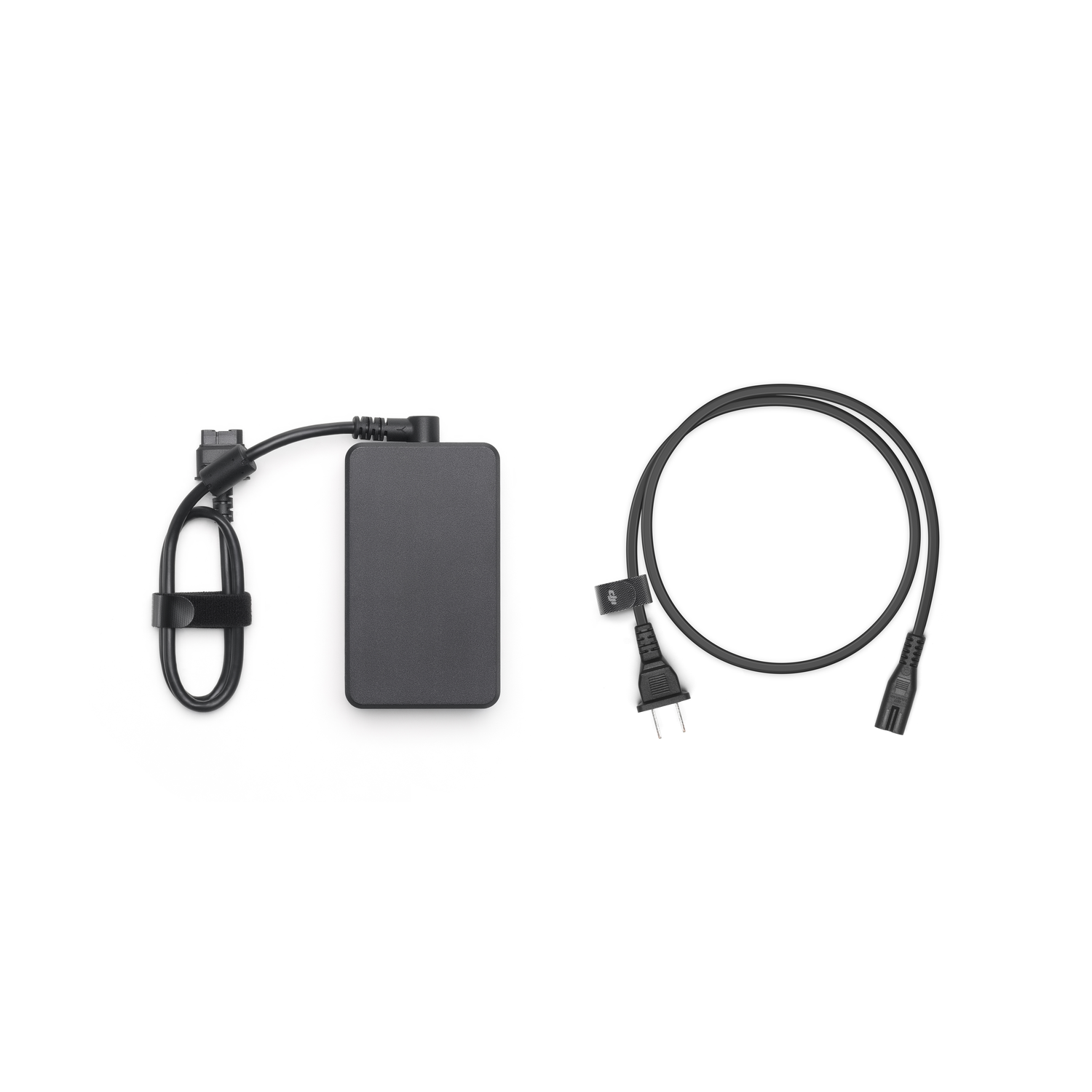 Phone charger and power cord set on a white background, top-down view.