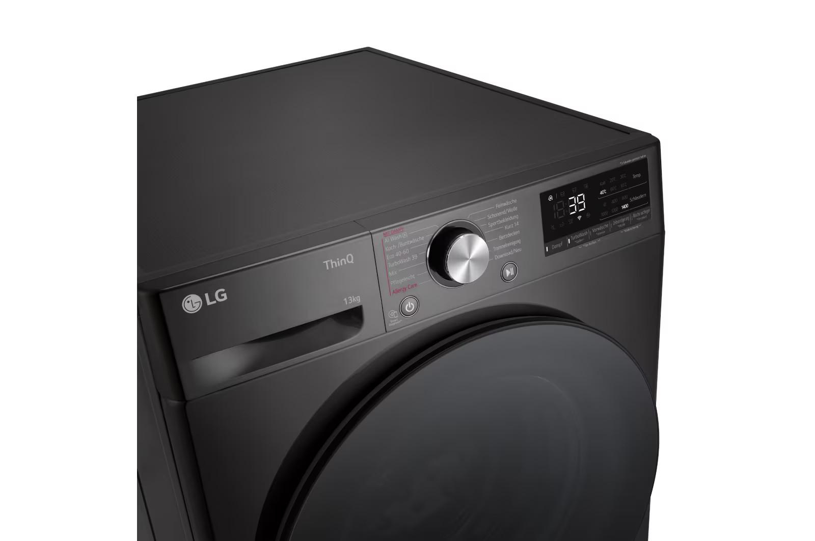 Eine schwarze LG Waschmaschine mit Bedienfeld oben.