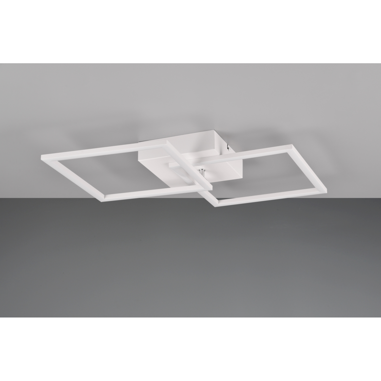 Un'apparecchio di illuminazione a soffitto bianco con un design quadrato. È montato su un soffitto grigio.