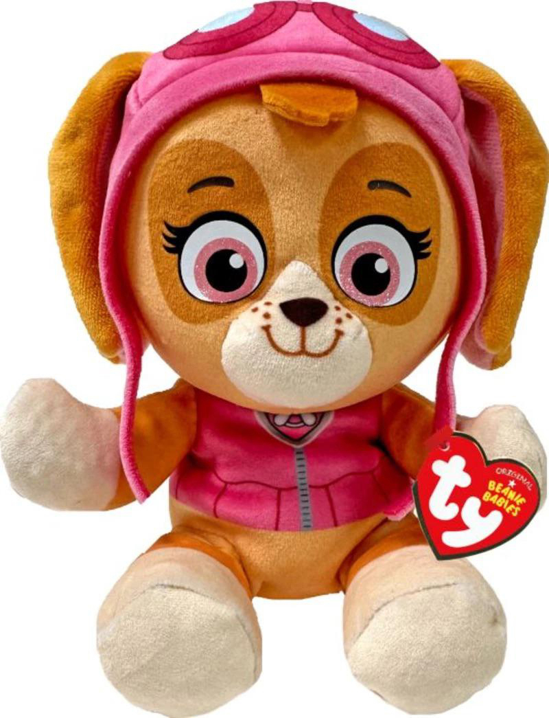 Ein Stofftier von Skye von Paw Patrol. Es hat einen rosa Hut und eine Weste, große Augen und ein Etikett mit der Aufschrift Beanie Babies.