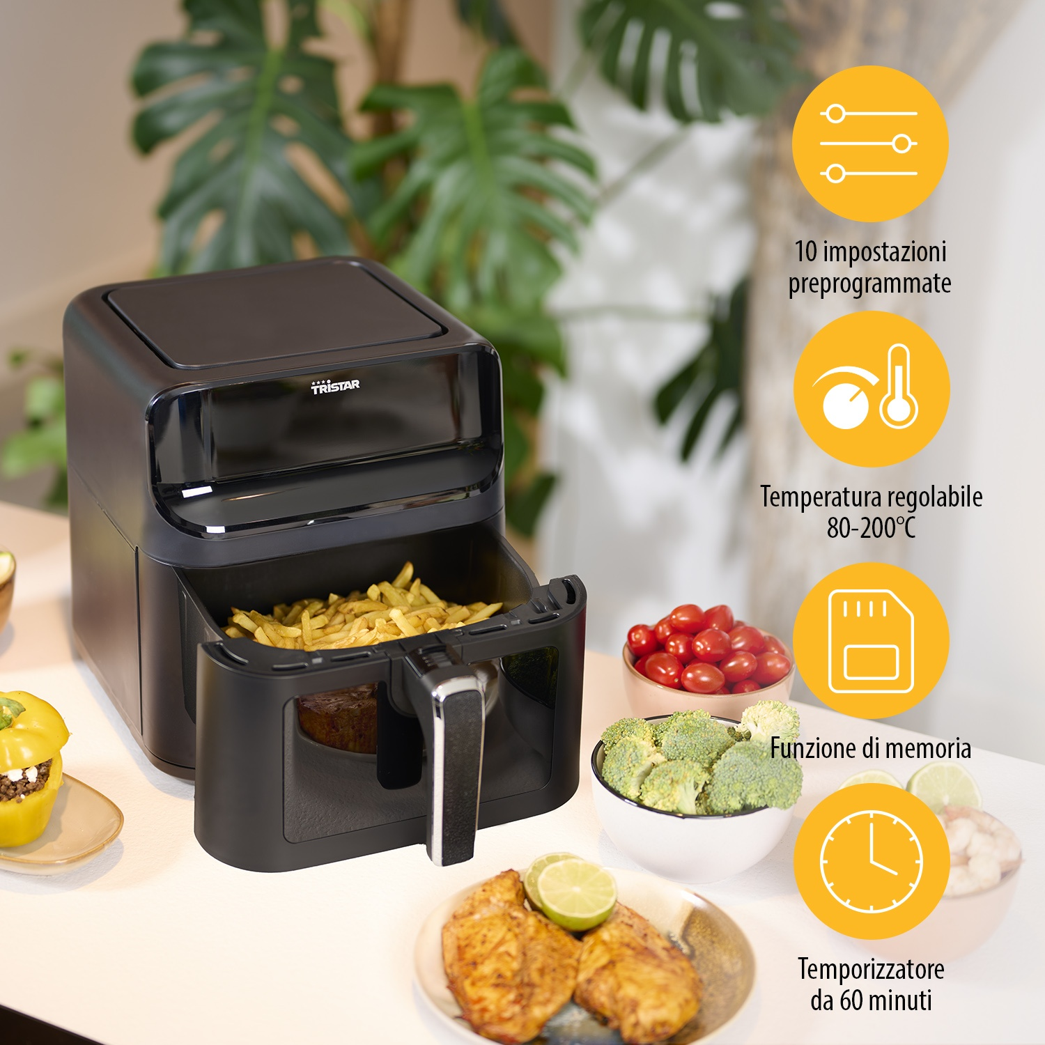 Friggitrice ad aria nera con cibo dentro e contorni, con etichette.