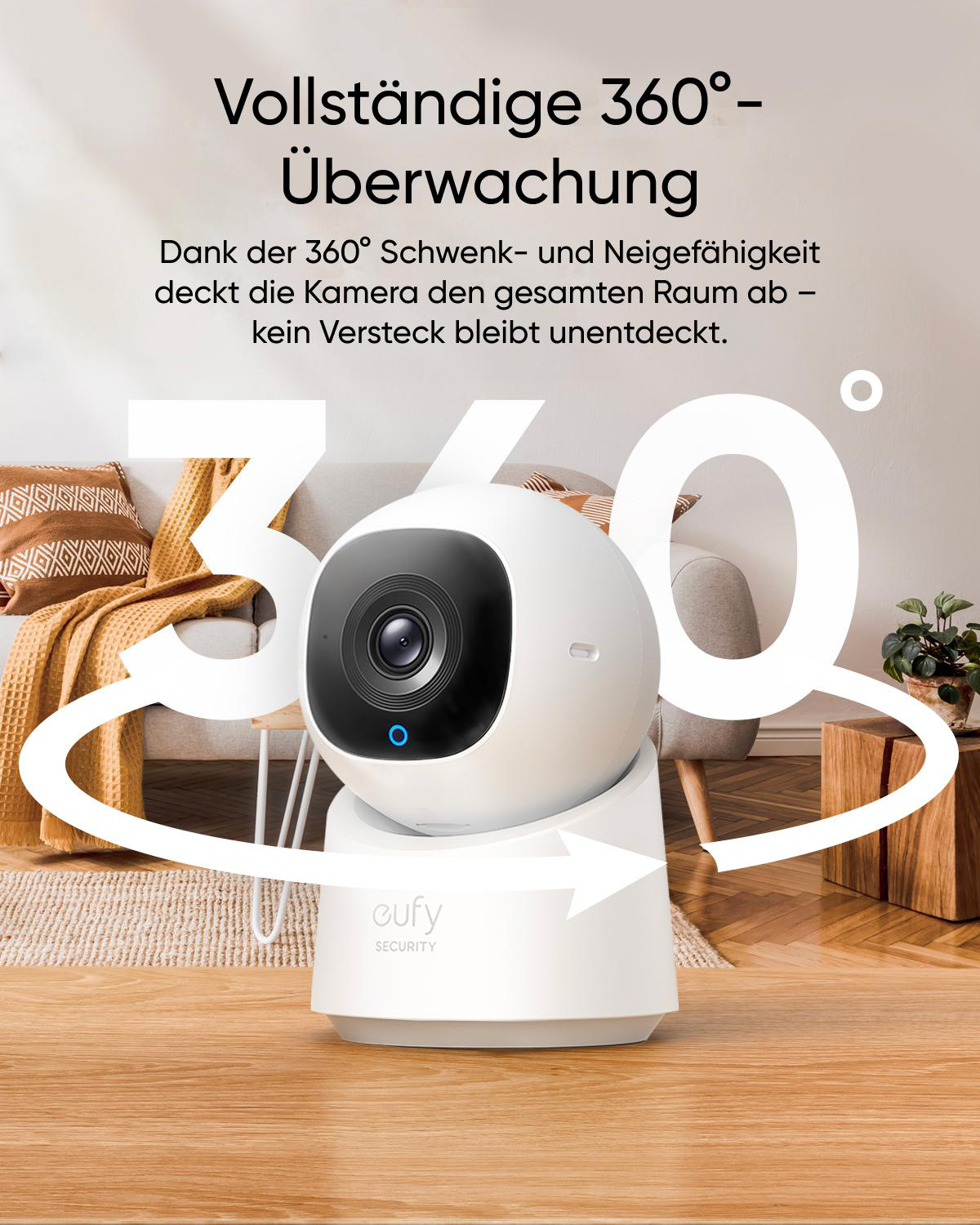 Eine weiße Sicherheitskamera mit blauem Licht auf einem Holztisch.