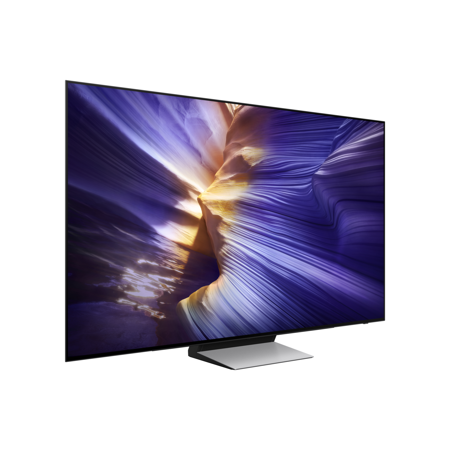 A television displays an abstract, purple and gold canyon on a black background.