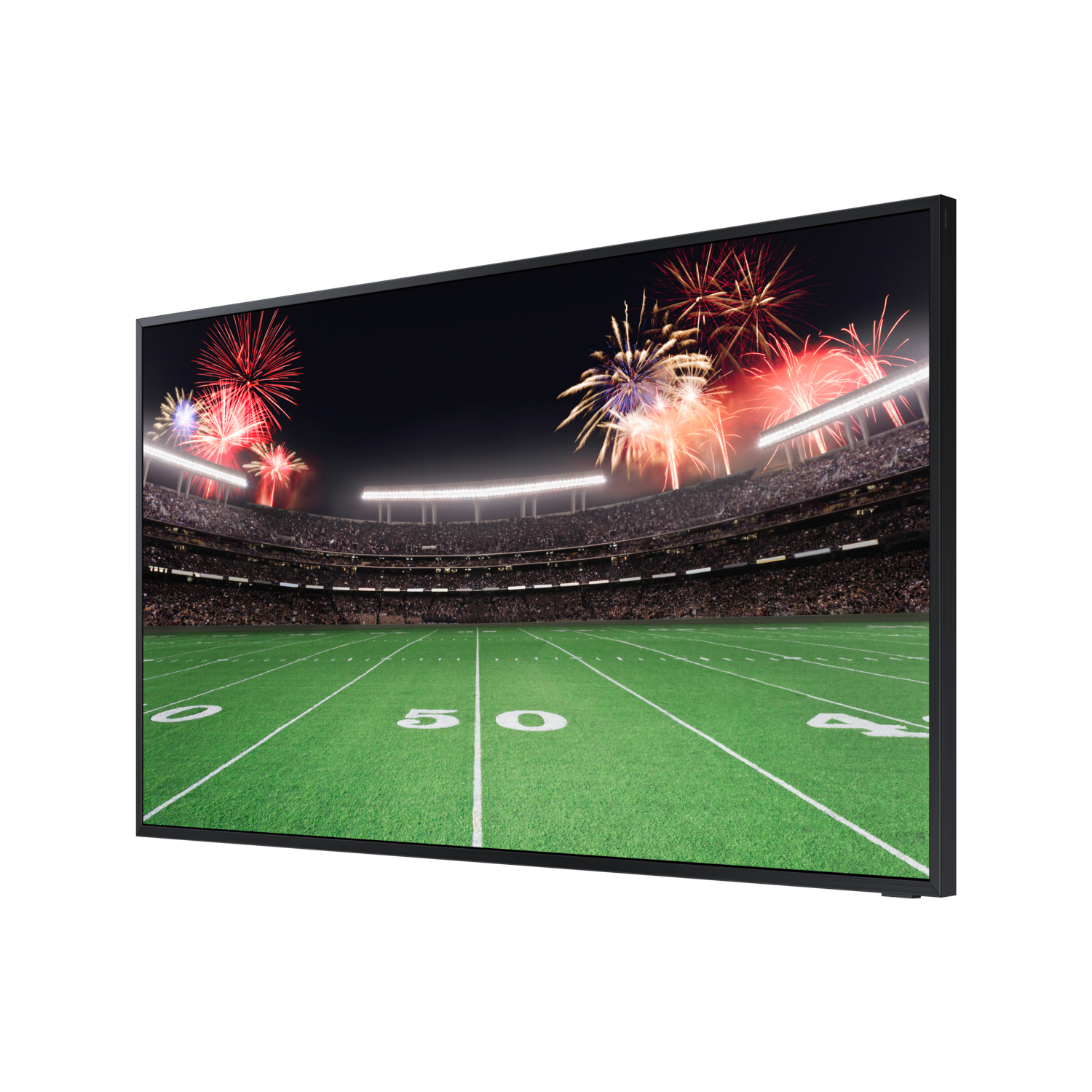A TV displays a football stadium with fireworks at night.