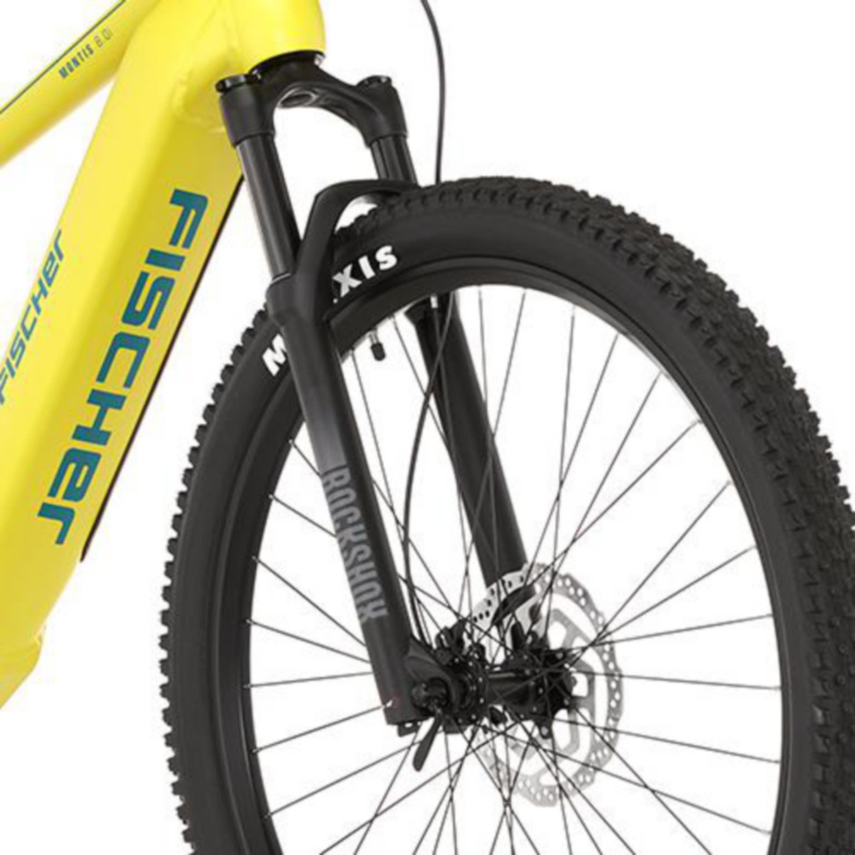 Nahaufnahme eines gelben Fischer-Fahrrads mit schwarzem Reifen und Rockshox-Federgabel.