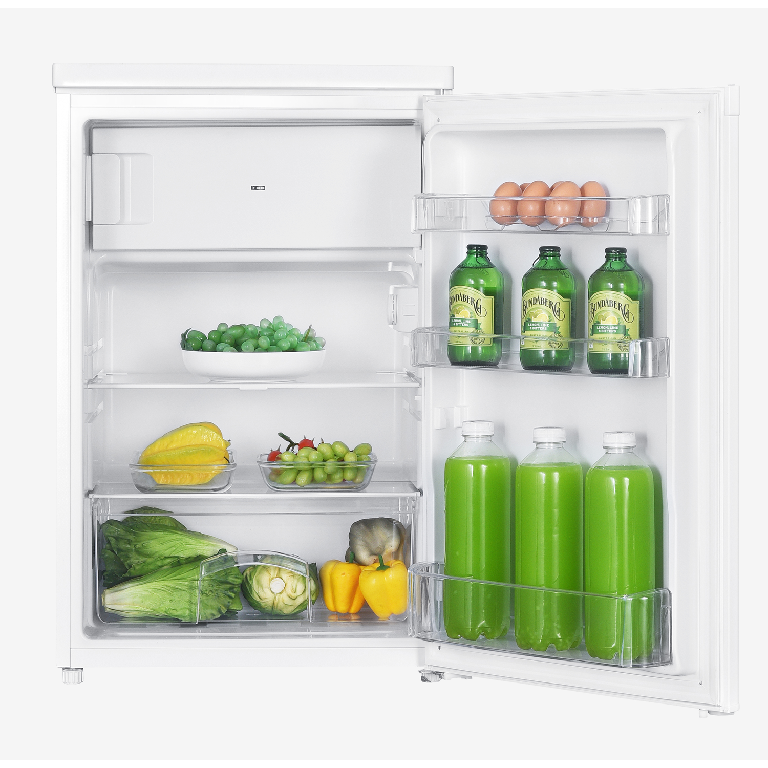 An open refrigerator shows various foods: grapes, eggs, green bottles, lettuce, yellow peppers, and green juice bottles.