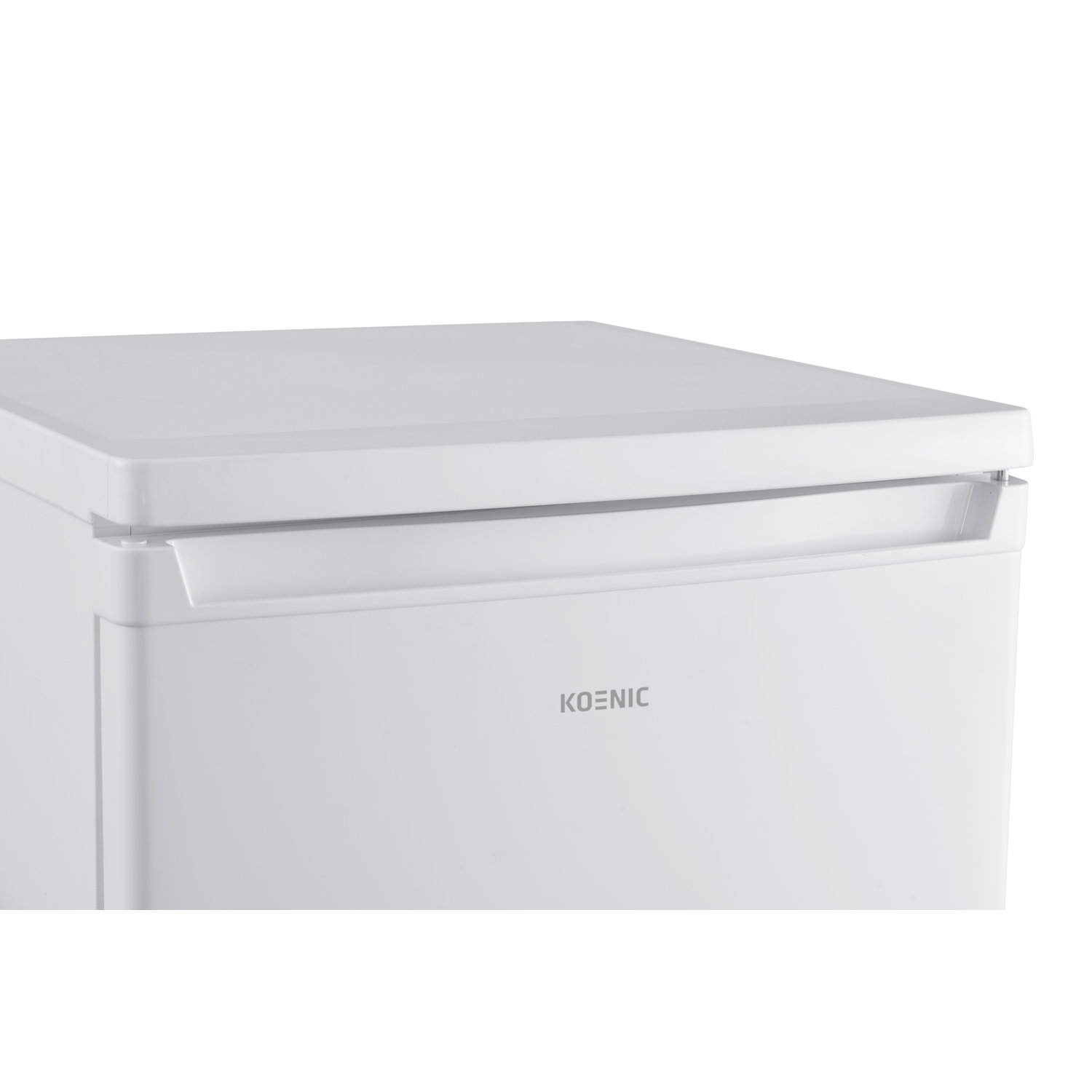 A close-up of a white Koenic freezer with a handle and the brand name. The background is black.