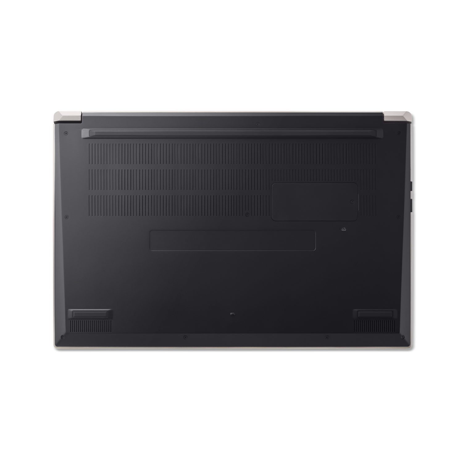 Bottom view of a laptop on a black background. The laptop is dark grey with ventilation slots and a light beige border.
