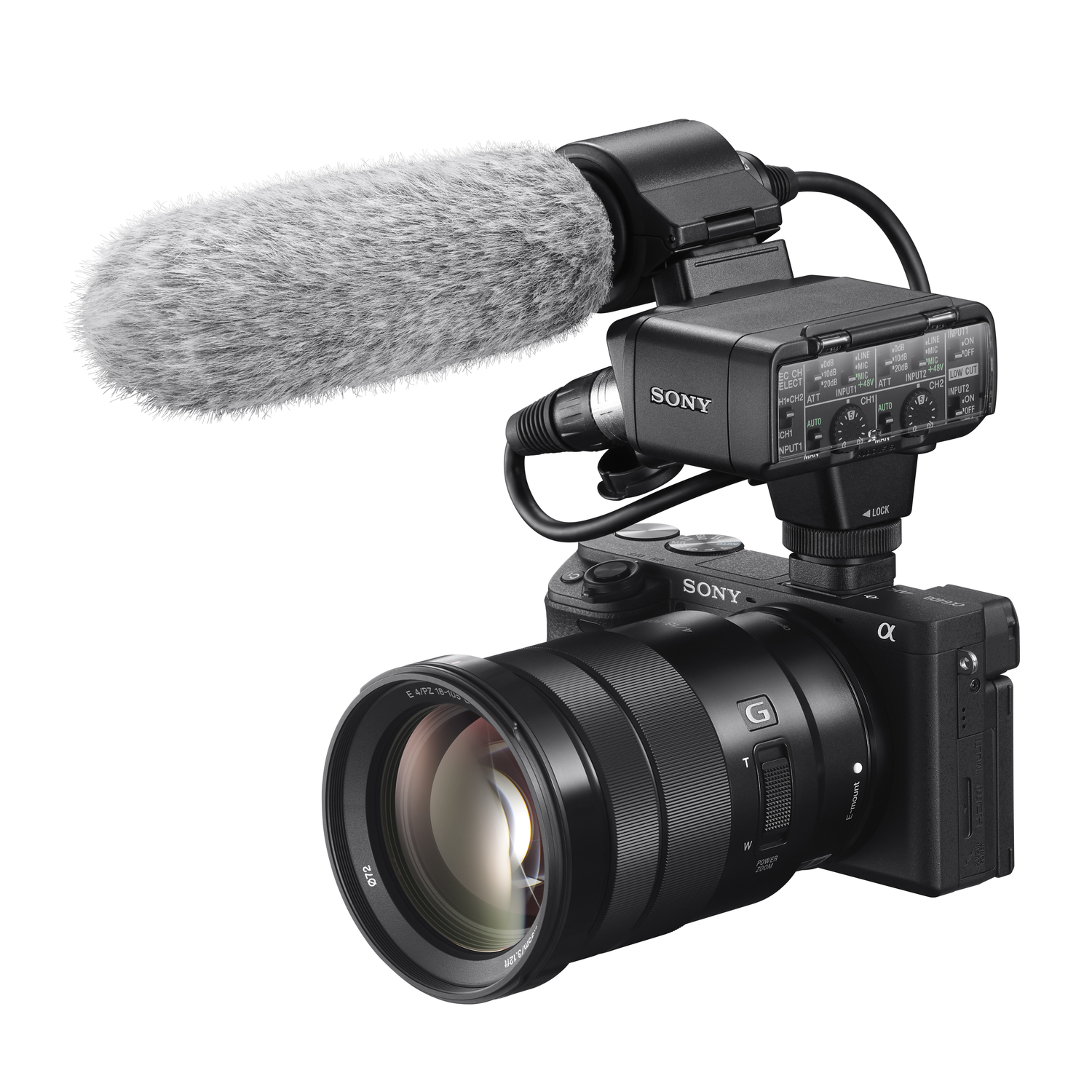 Sony camera with microphone and lens attached, white background, G lens.