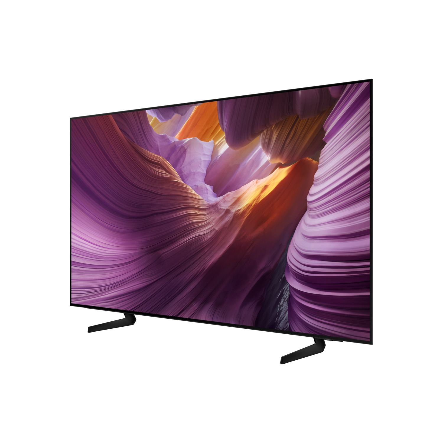 Un grand téléviseur affiche un paysage de formations rocheuses violettes, oranges et jaunes. Il a des pieds noirs et un cadre noir sur fond blanc.