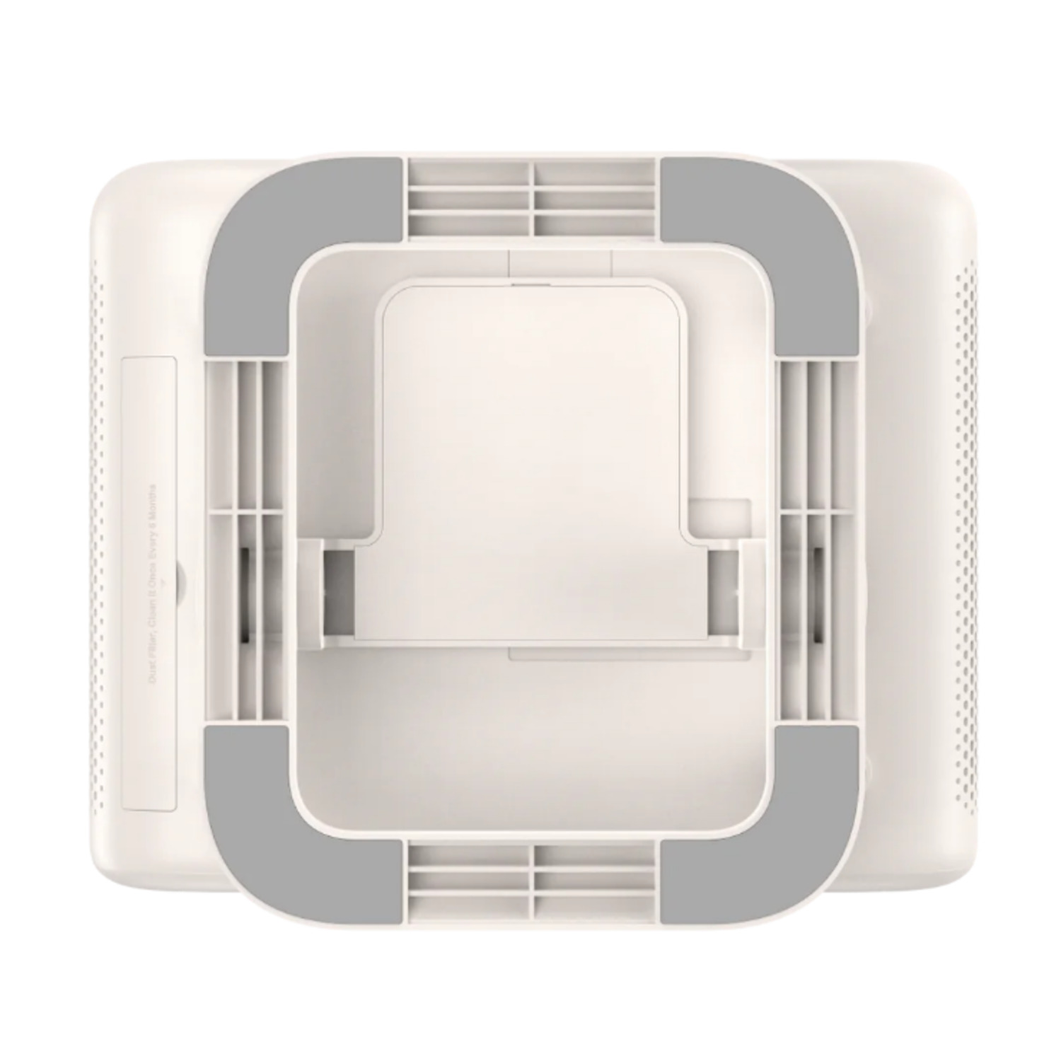 Vue aérienne d'une base de purificateur d'air blanche avec des coussinets d'angle gris et des grilles internes, sur fond blanc.